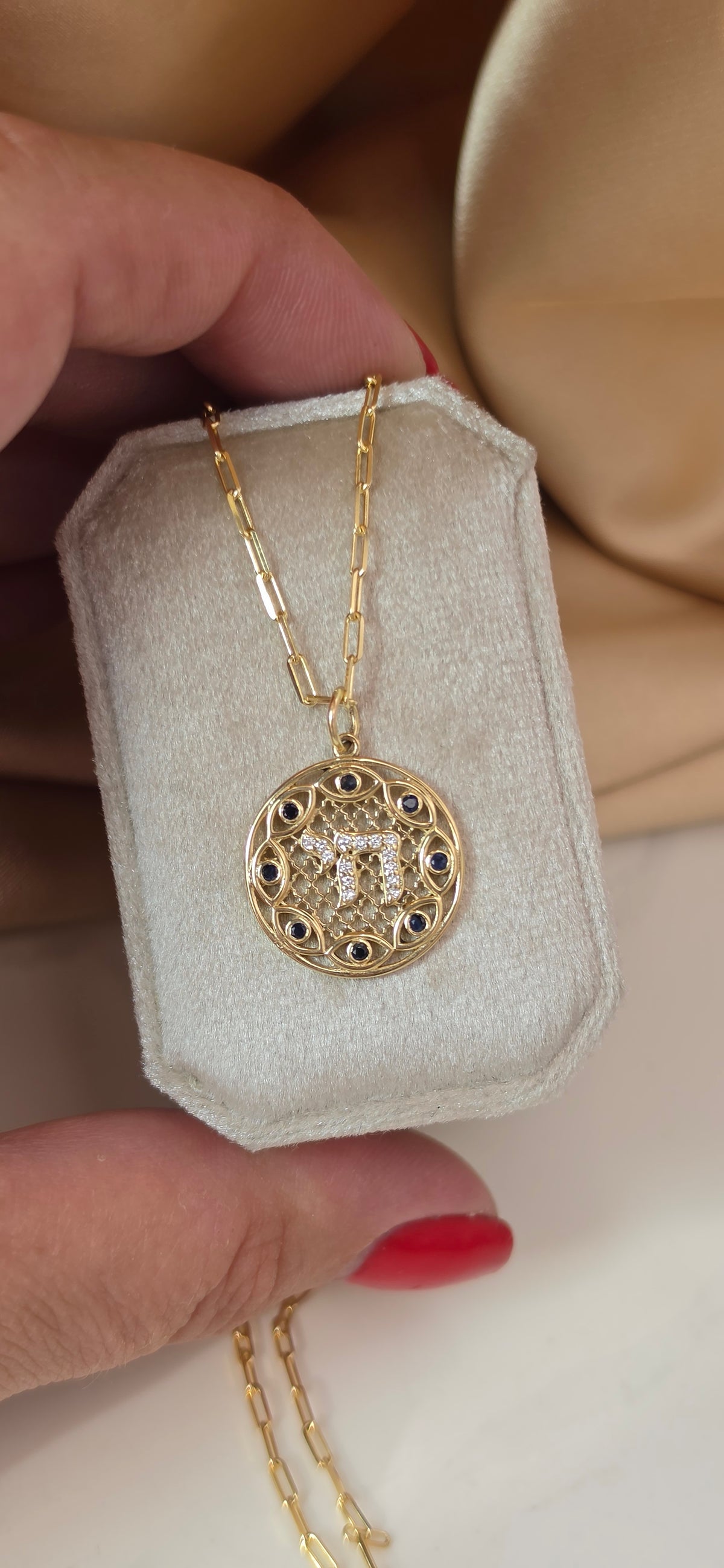 Hai and eye pendant
