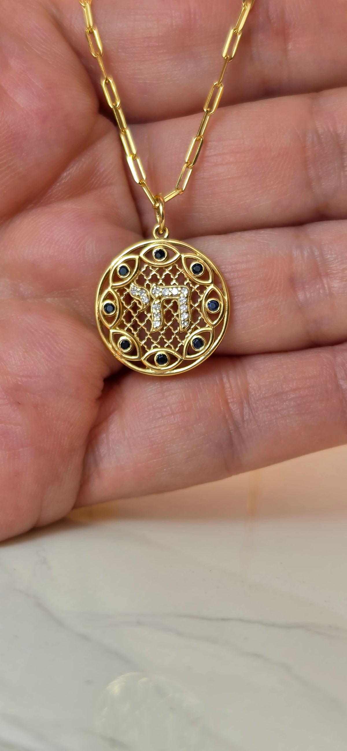 Hai and eye pendant