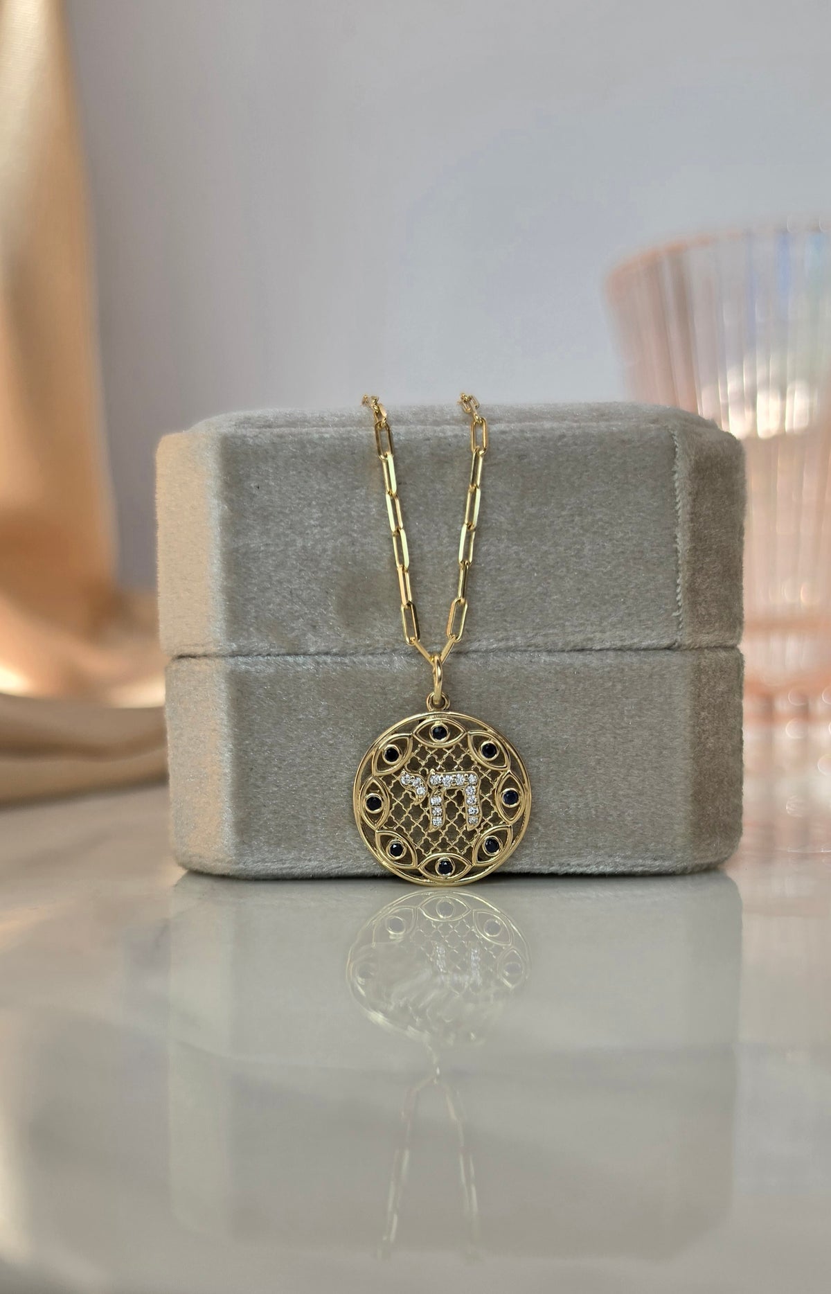 Hai and eye pendant