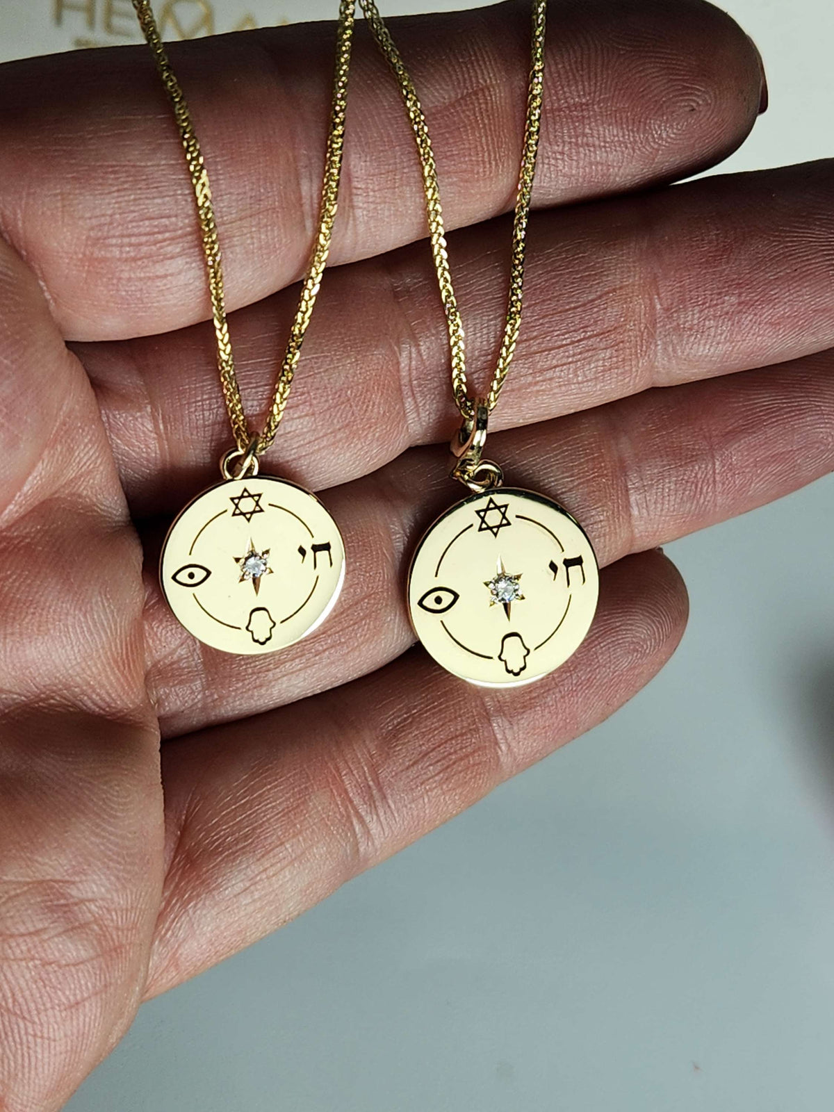 Medium size "Jewish compas" necklace, 14k gold set with a natural diamond.