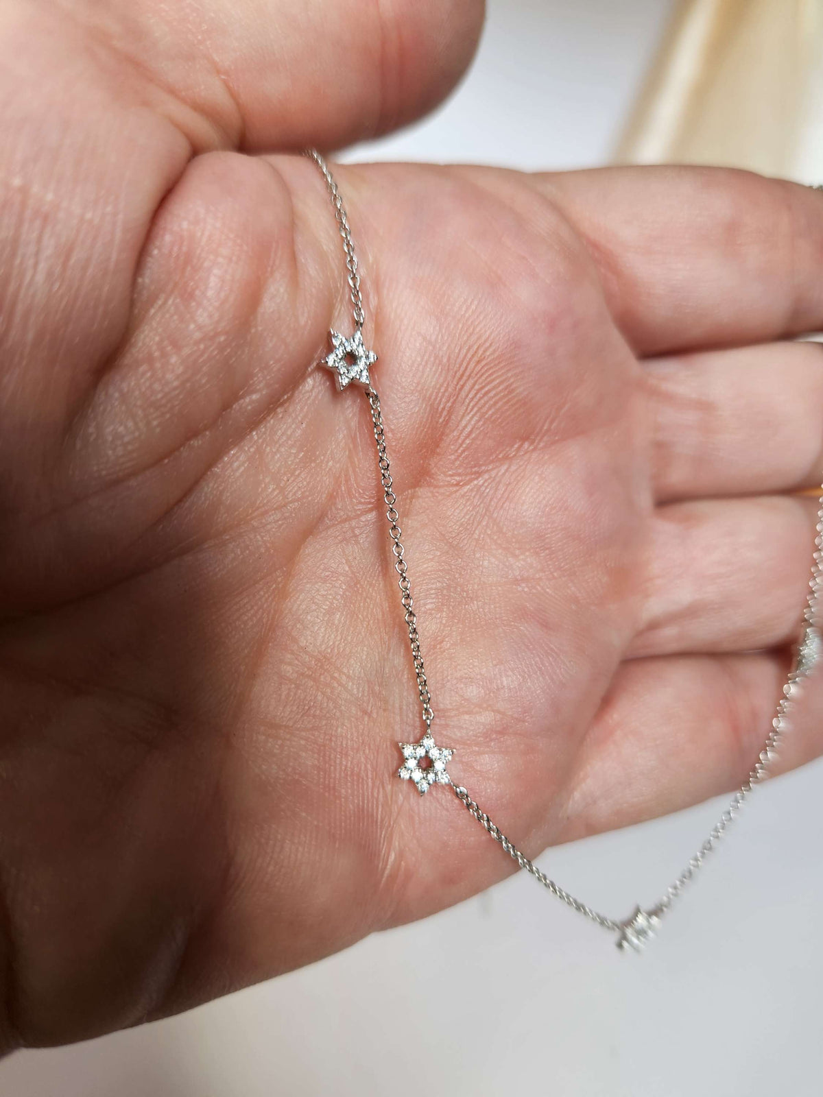 Five star of David necklace 14k gold set with diamonds.