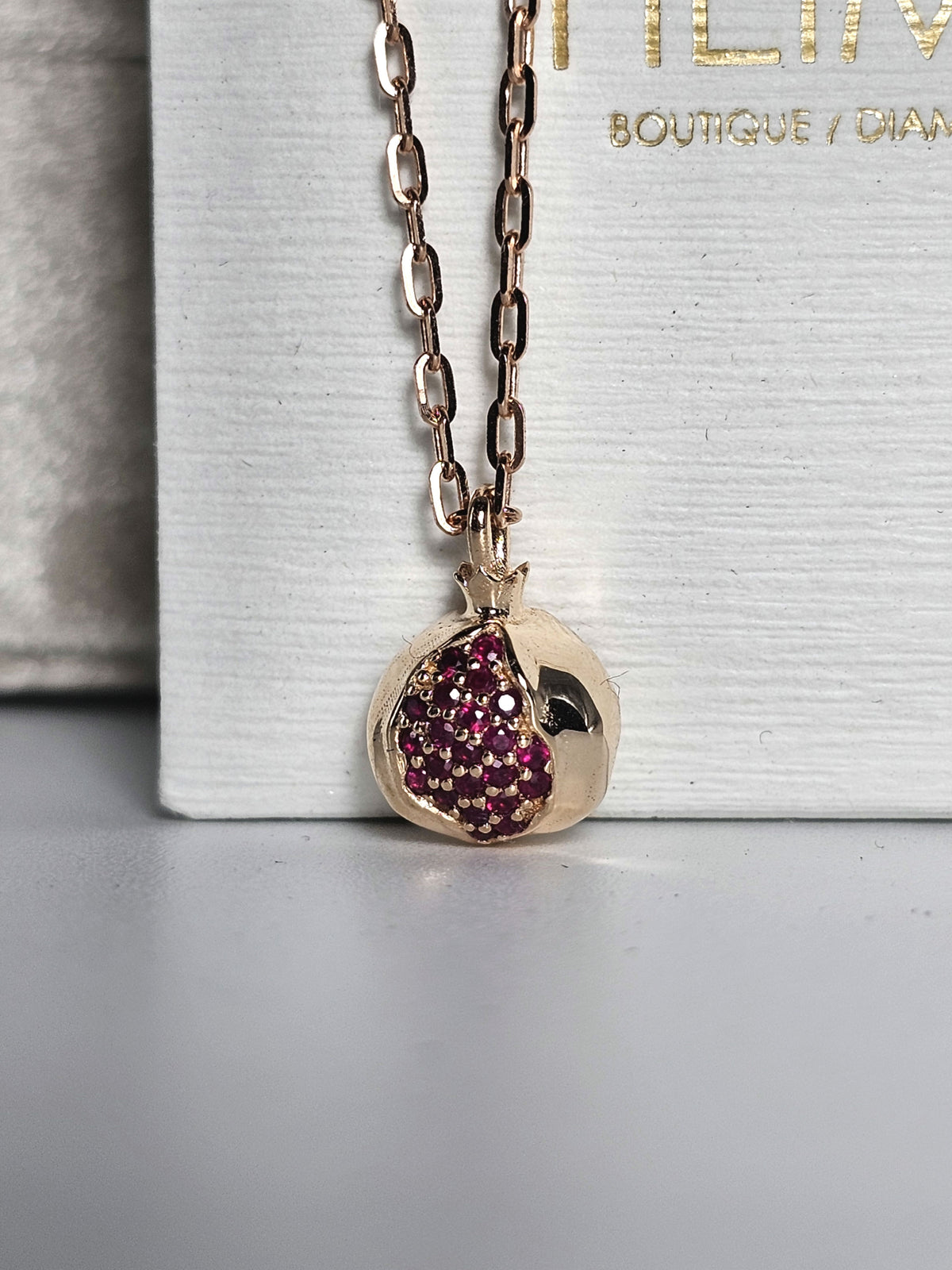 Mini Ruby Star Pomegranate 14k pendant 10mm long comes on 14k chain.