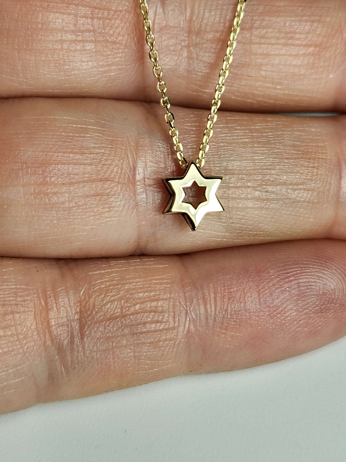 Mini Star of David necklace 7mm wide 14k, comes on 14k chain.