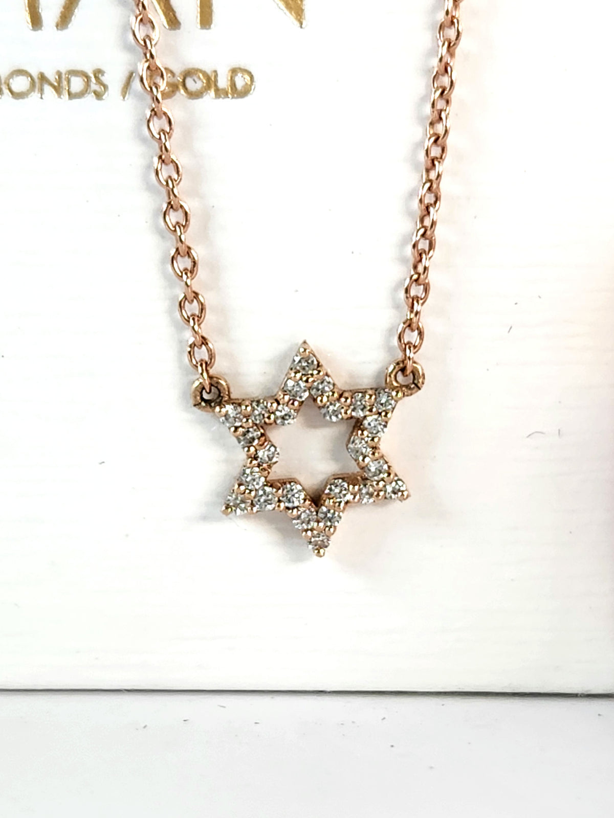 Star of David necklace 14k set with natural diamonds 0.17 carat.