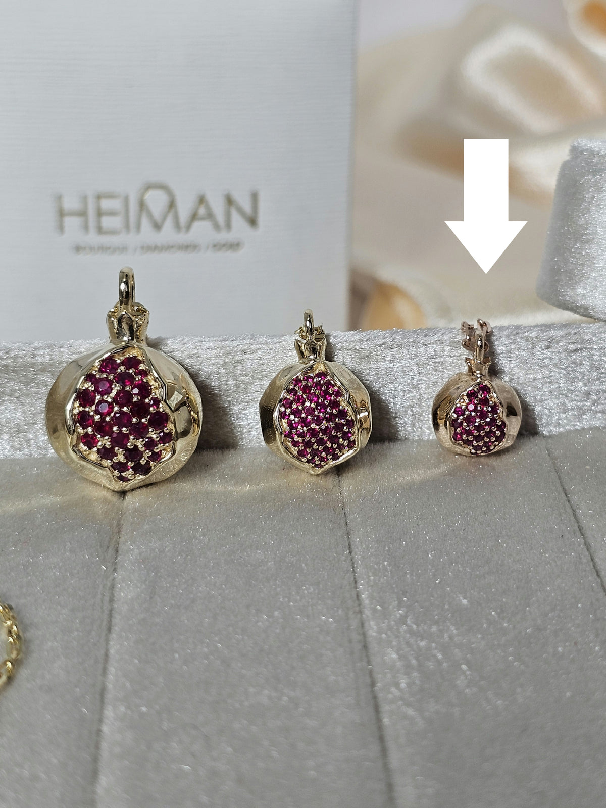 Baby pomegranate pendant 14k gold set with natural ruby's without a chain.