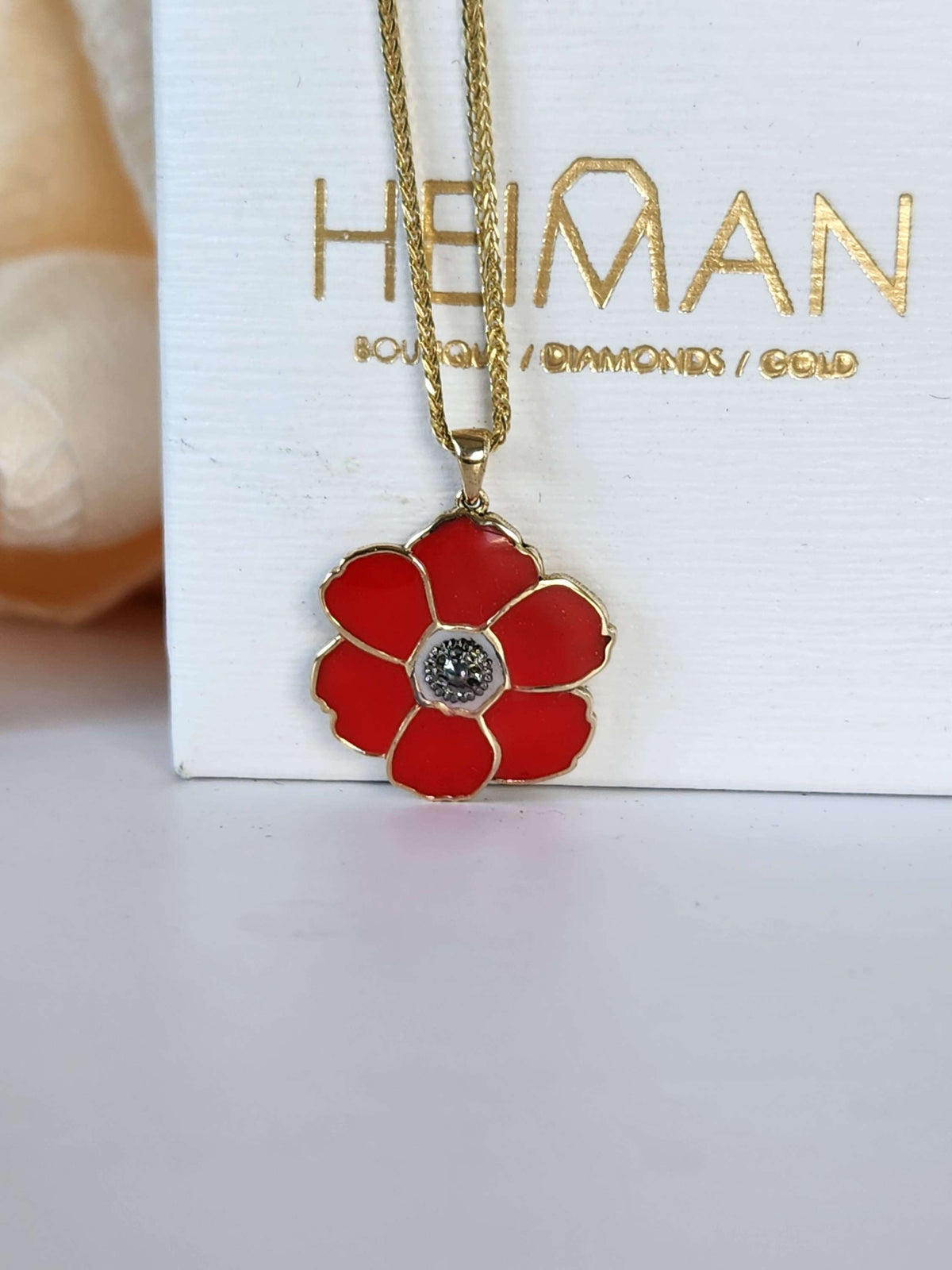 Poppyseed pendant, 14k yellow gold and enamel, comes on 14k chain.