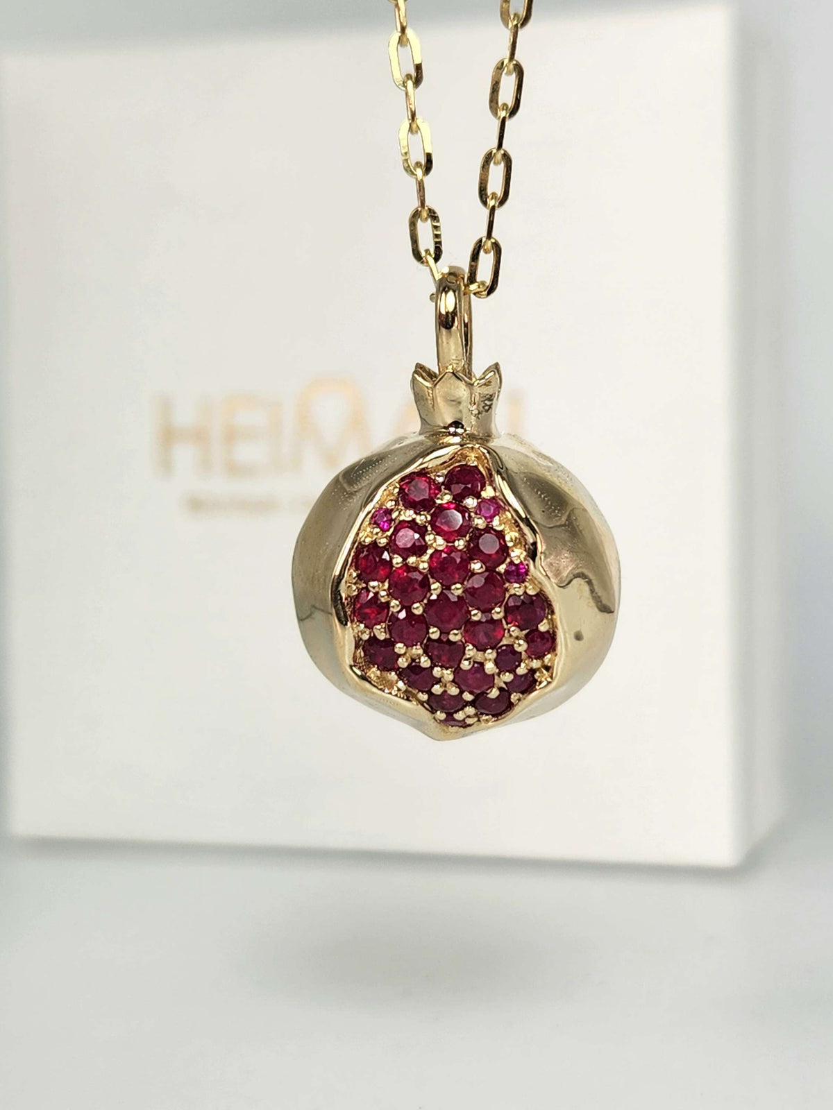 Large 20mm pomegranate in 14k gold set with natural ruby's
