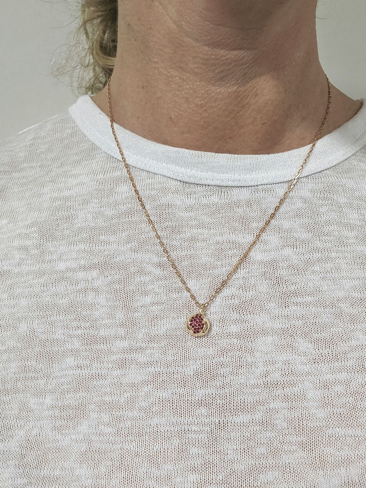 Mini Ruby Star Pomegranate 14k pendant 10mm long comes on 14k chain.