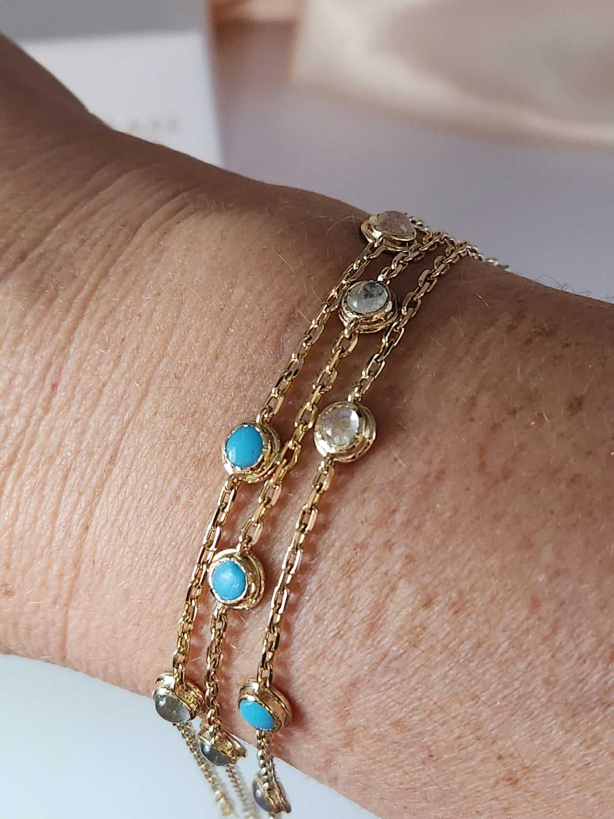 Gold eye bracelet set with natural gems.