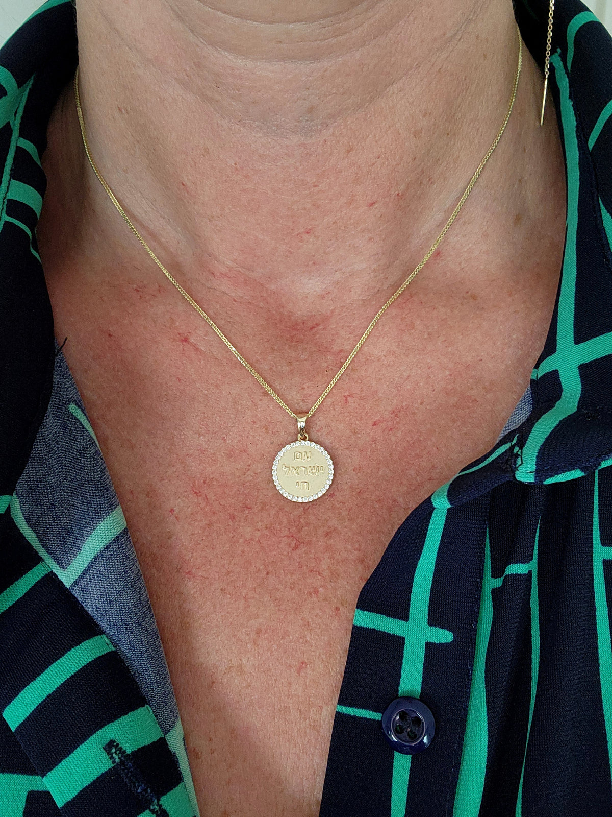 Am Israel Hai 14k gold pendant set with cvd diamonds on a 14k chain.