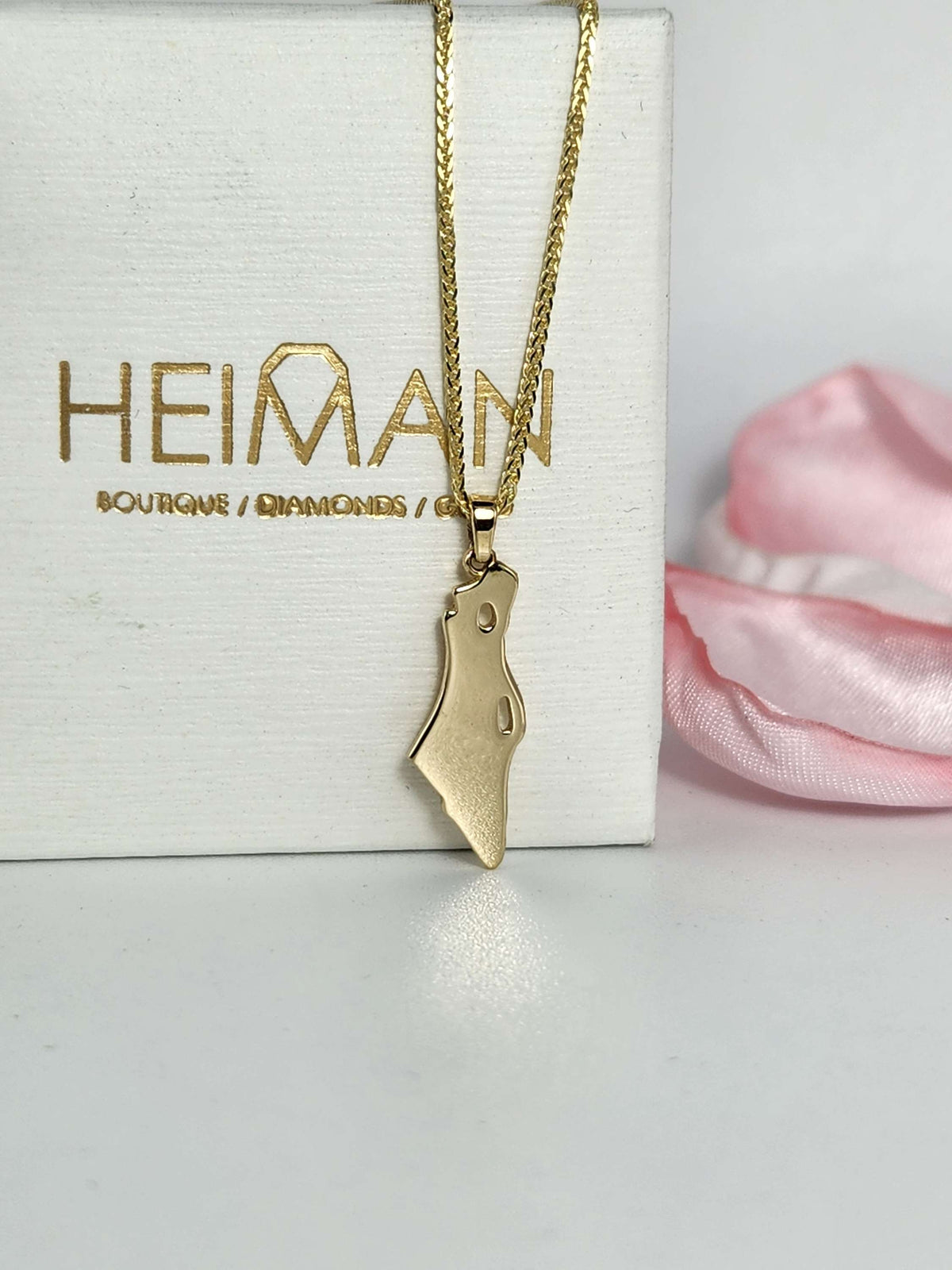 Map of Israel necklace 14k gold comes on a 14k chain.