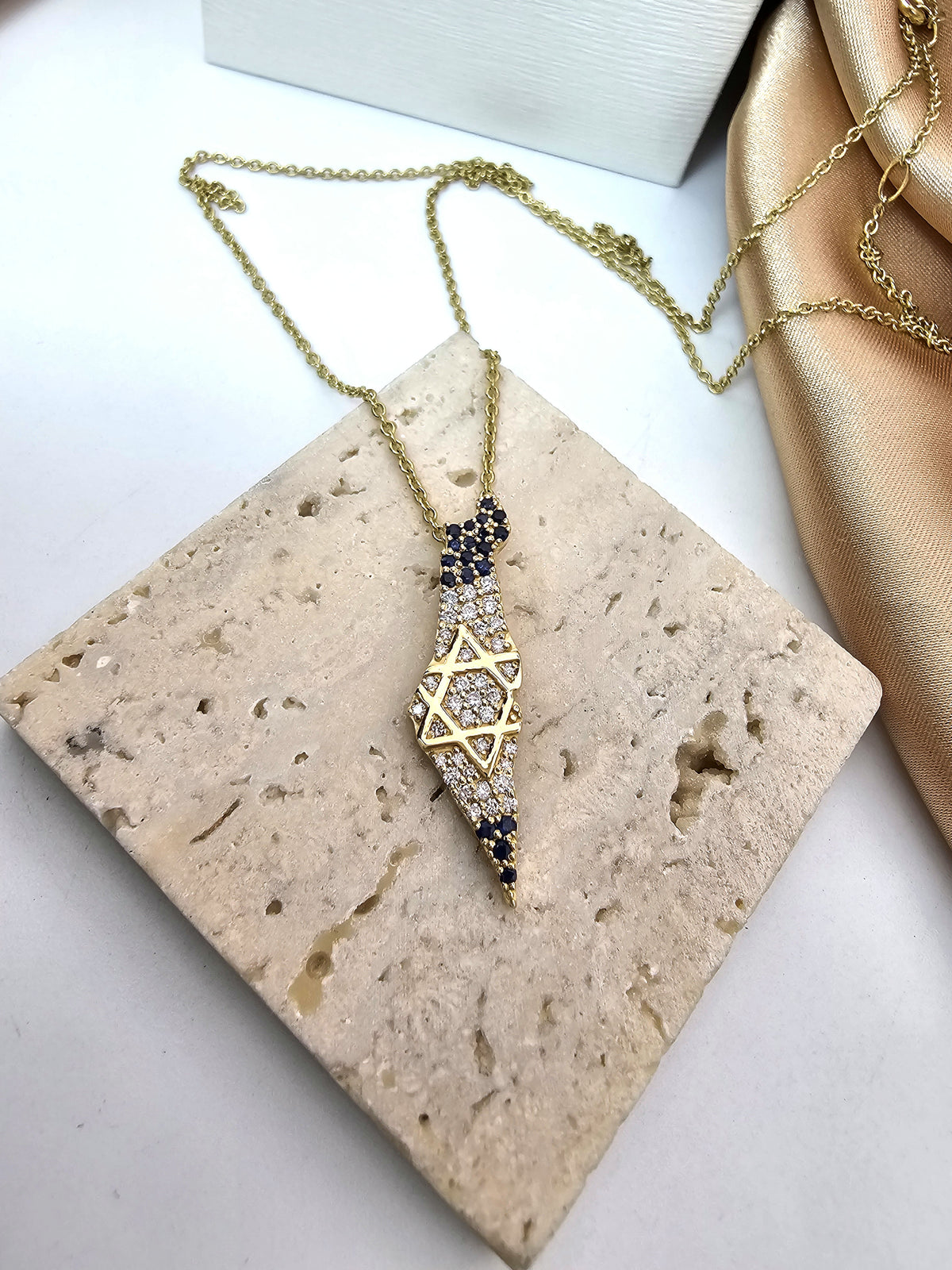 map of Israel set with cvd diamonds and blue sapphires.