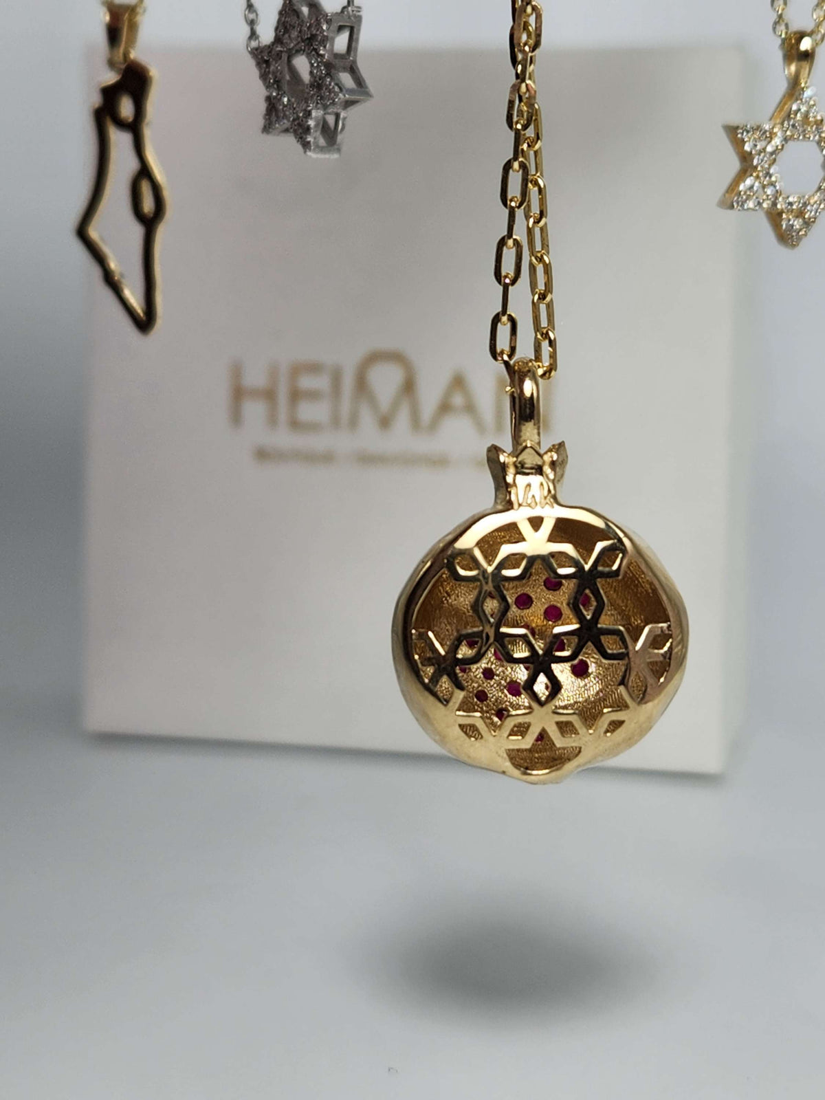 Large 20mm pomegranate in 14k gold set with natural ruby's