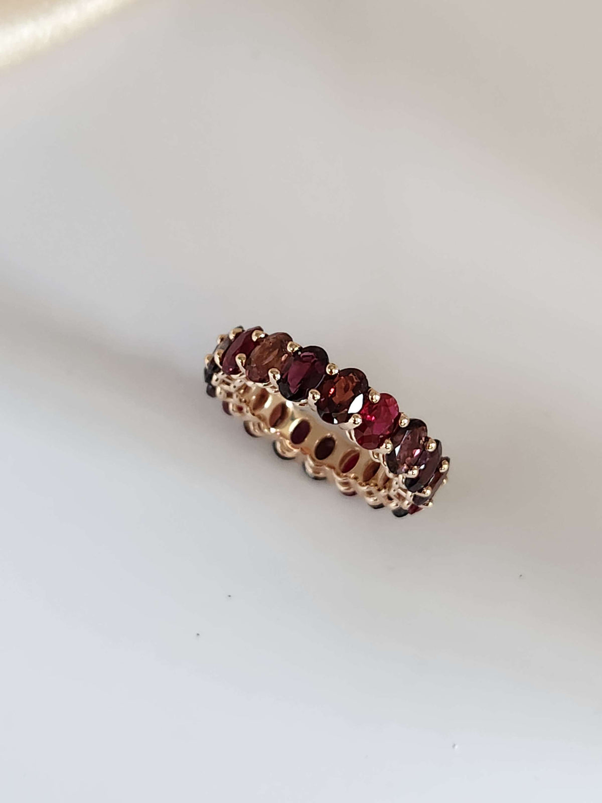 The "Red dream" ring. 14k rose gold infinity ring set with lab garn, tourmaline