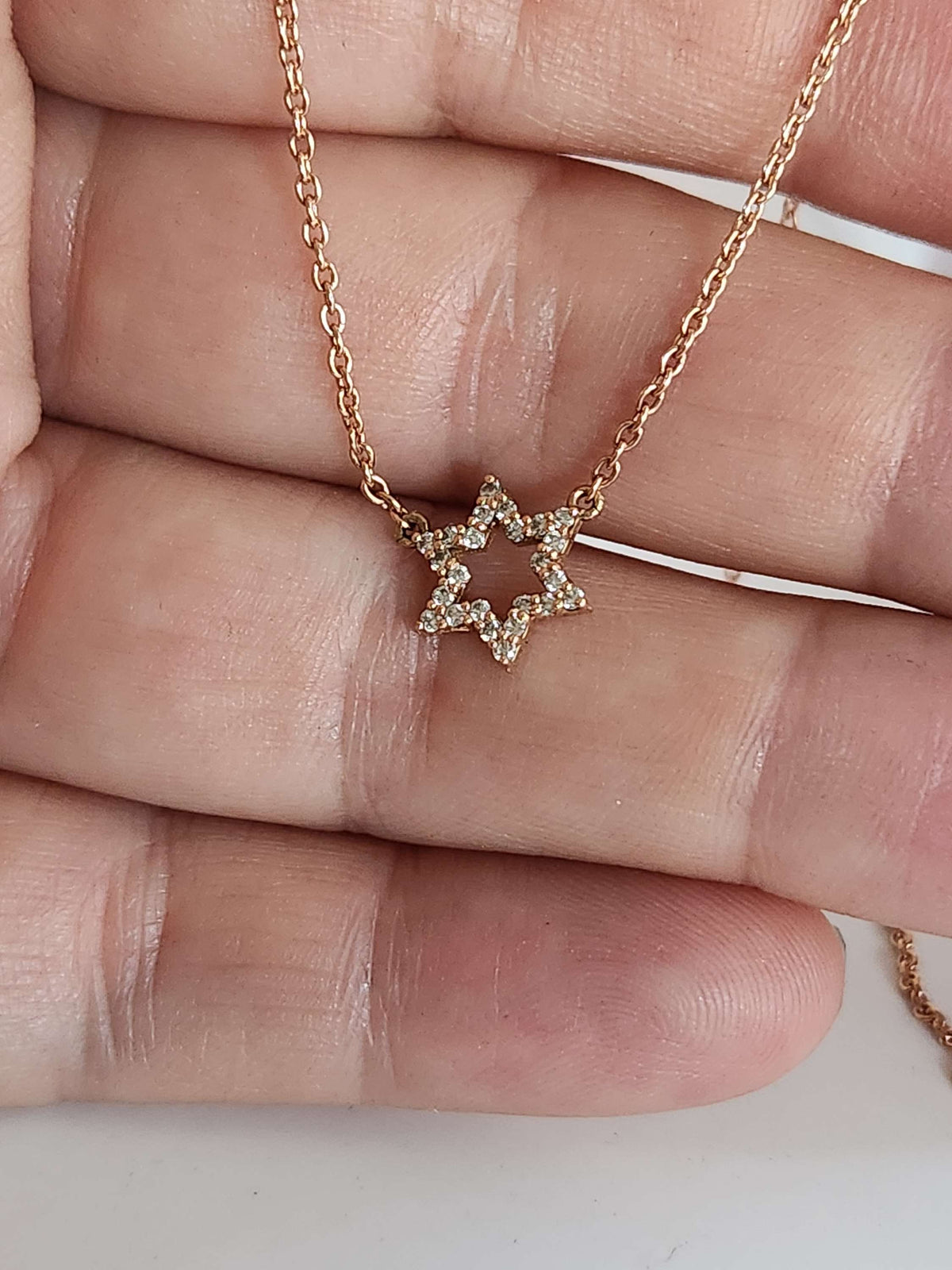 Star of David necklace 14k set with natural diamonds 0.17 carat.