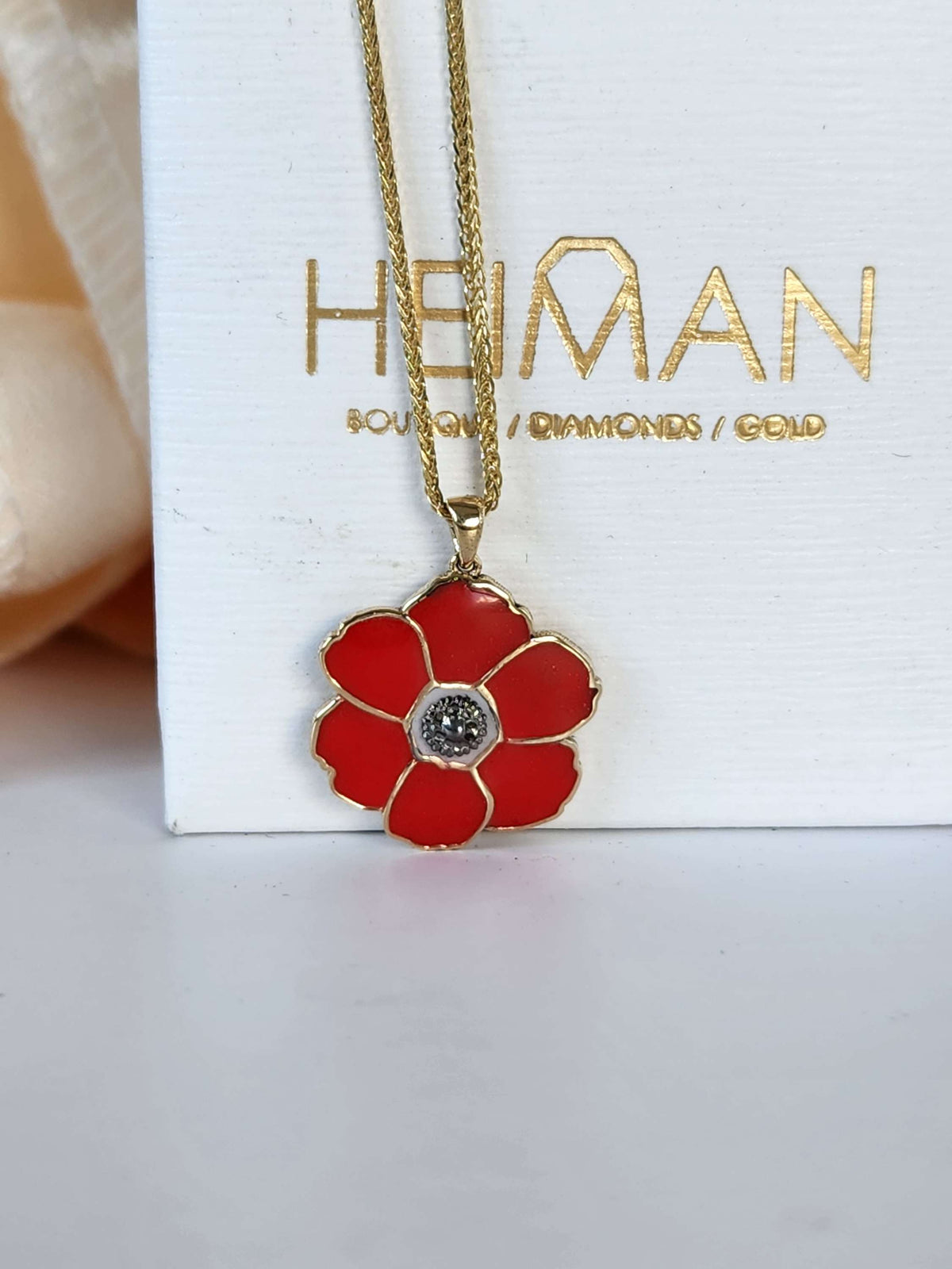 Poppyseed pendant, 14k yellow gold and enamel, comes on 14k chain.