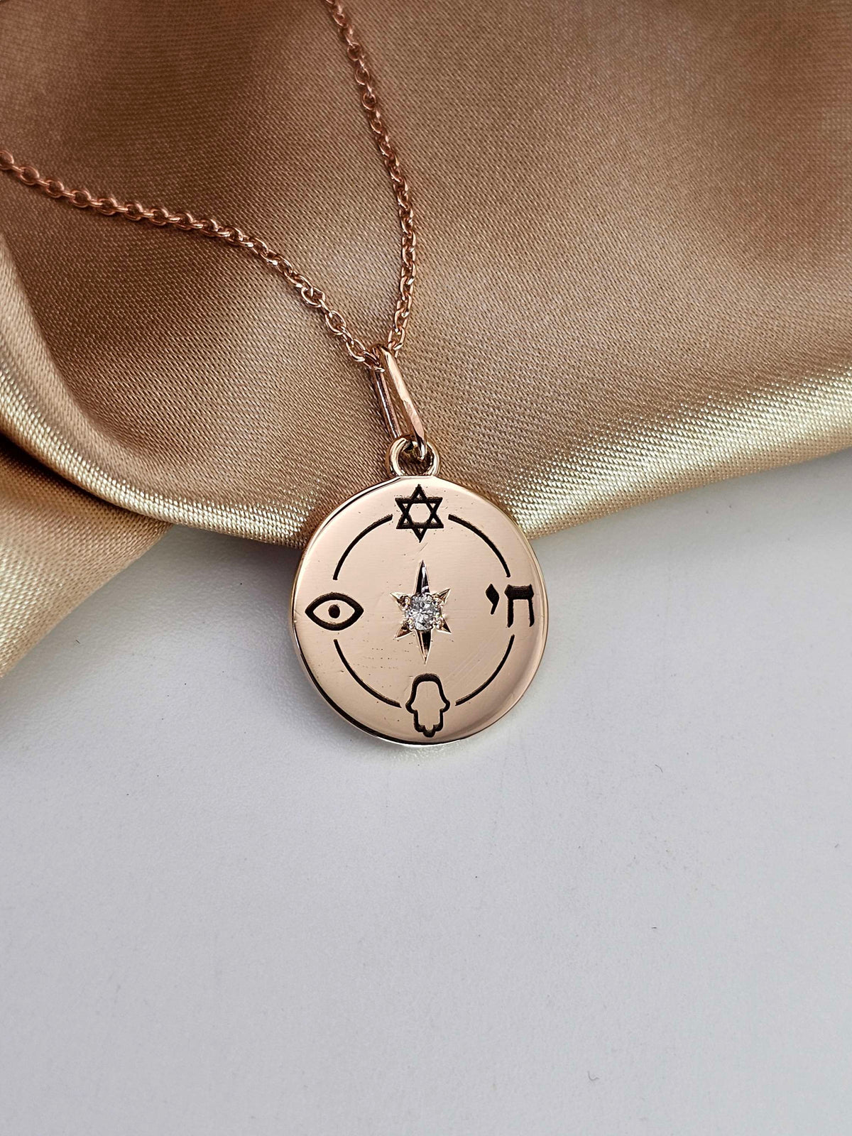 Small "Jewish compas" necklace, 14k gold set with natural diamond.