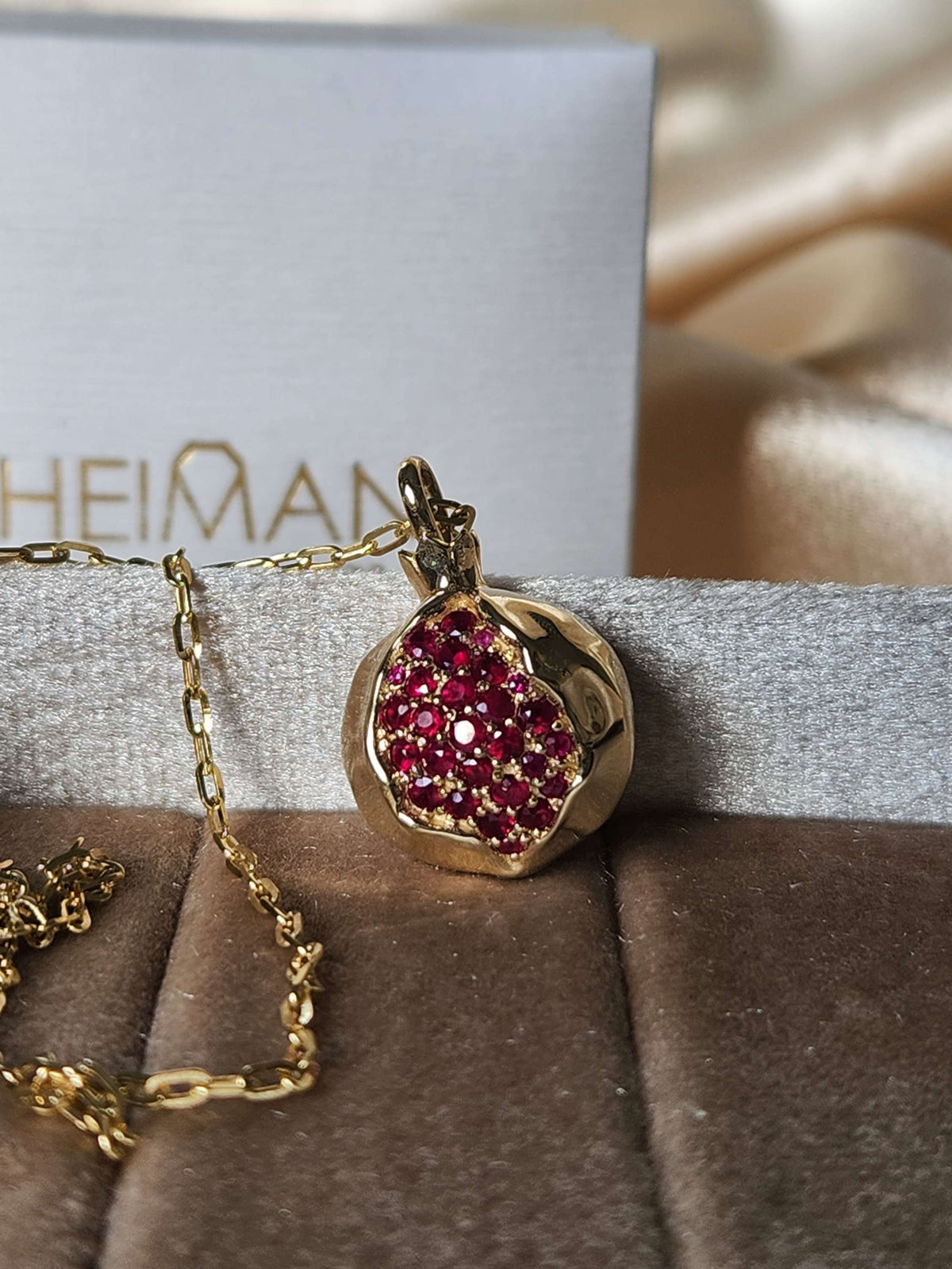 Large 20mm pomegranate in 14k gold set with natural ruby's