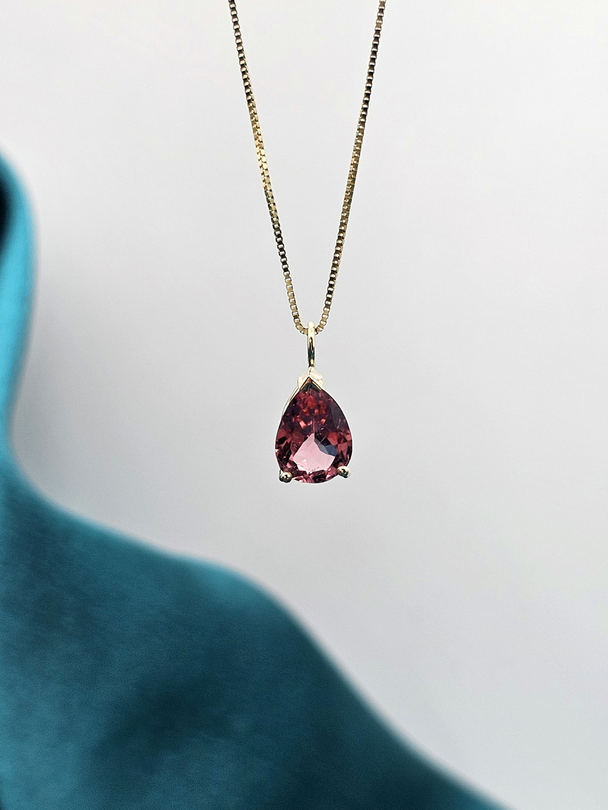 Pear shape Pink tourmaline pendant in 14k yellow gold.
