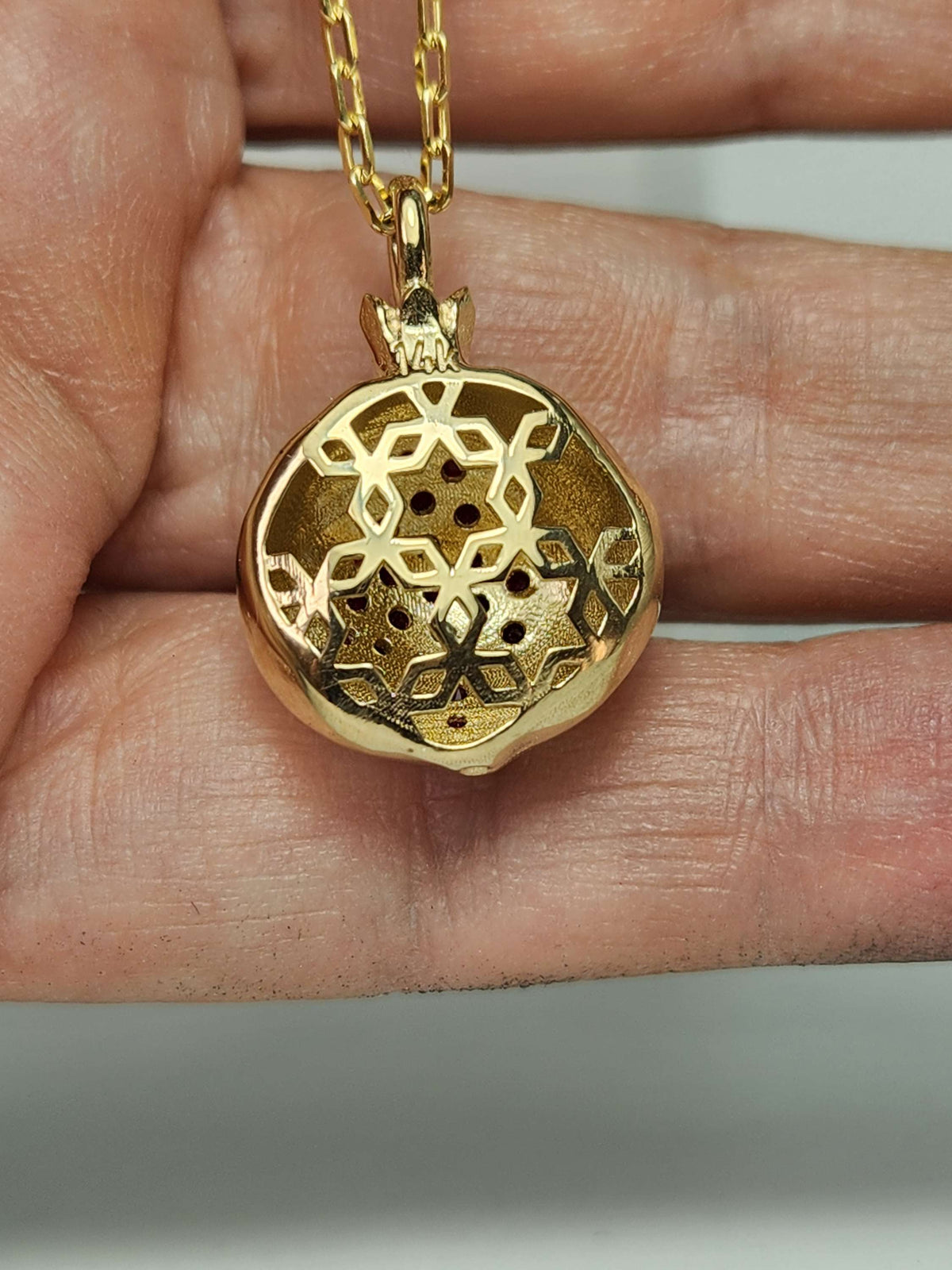 Large 20mm pomegranate in 14k gold set with natural ruby's