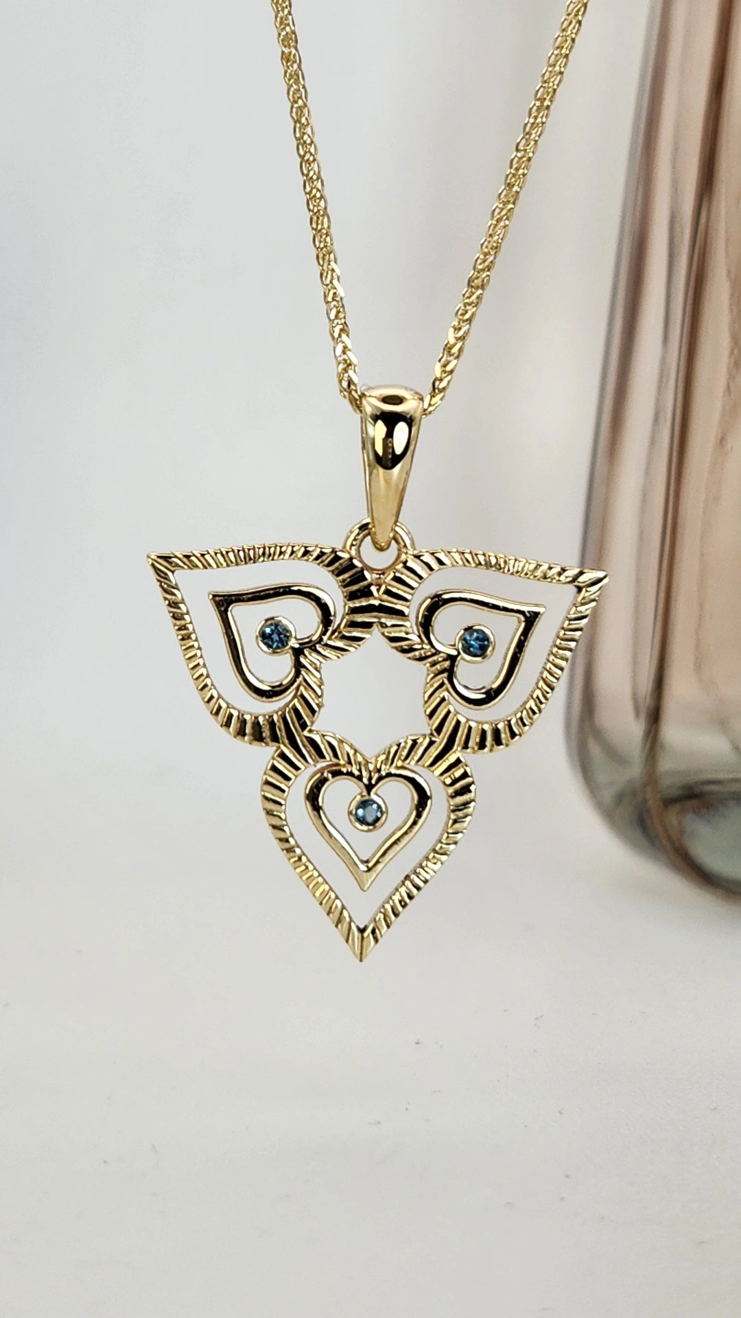 heart necklace 14k gold set with blue topaz comes on a 14k yellow chain
