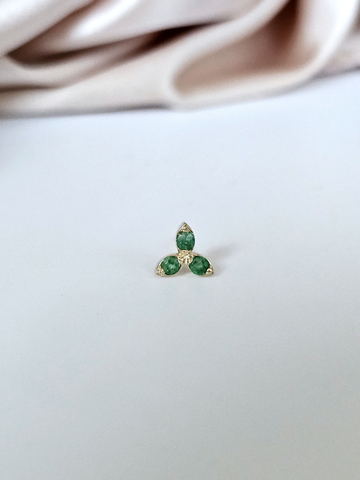 Single three stone stud earring, 14k gold set with natural Emerald.