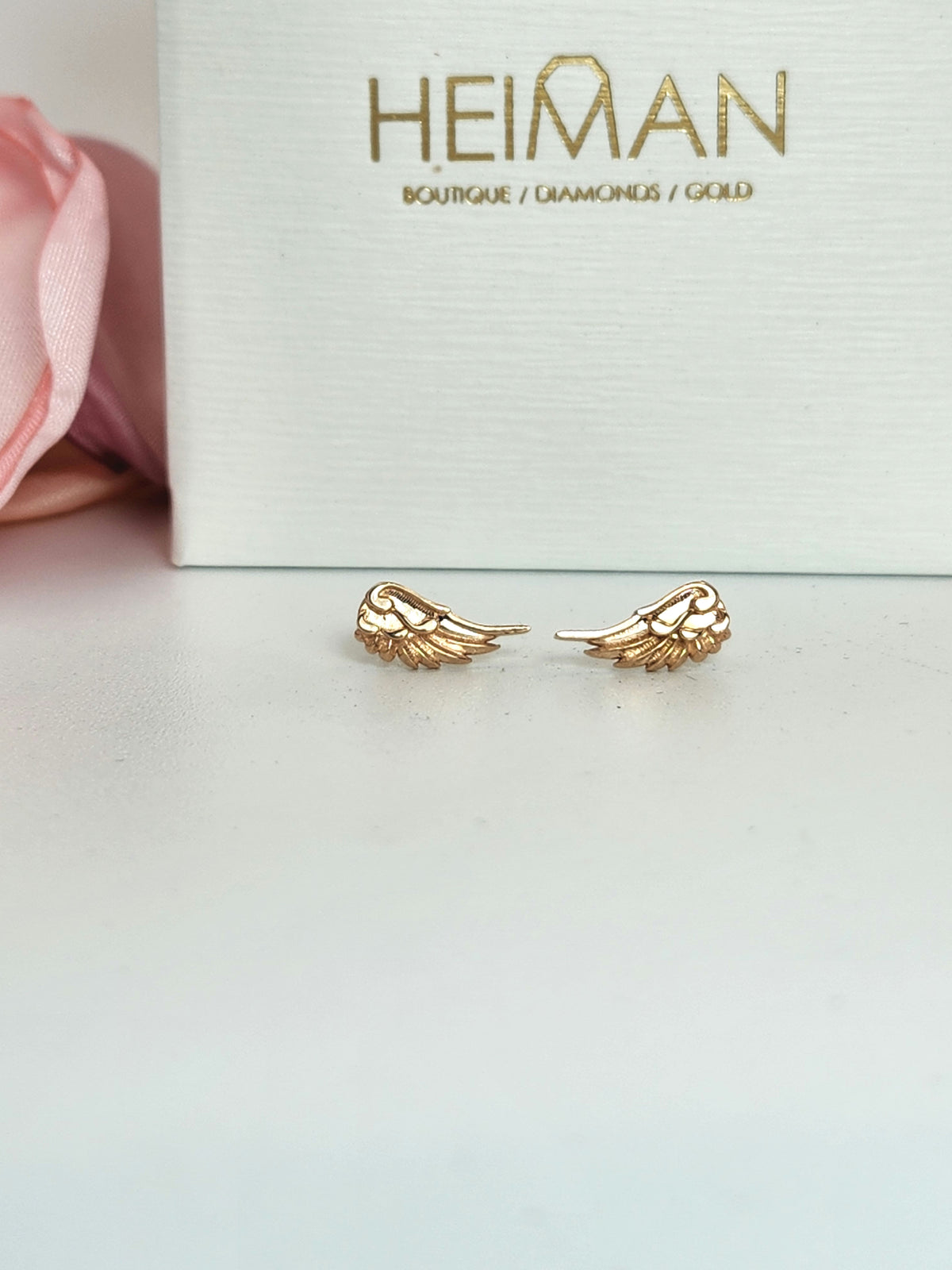 Wing stud earrings 14k rose gold.