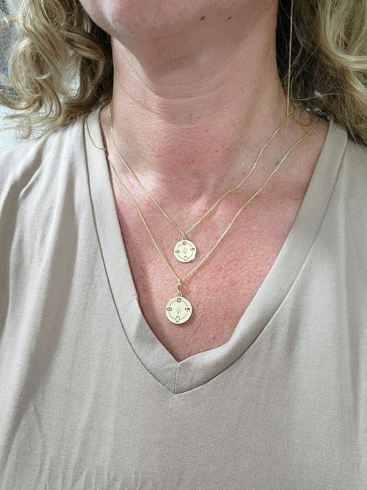 Medium size "Jewish compas" necklace, 14k gold set with a natural diamond.