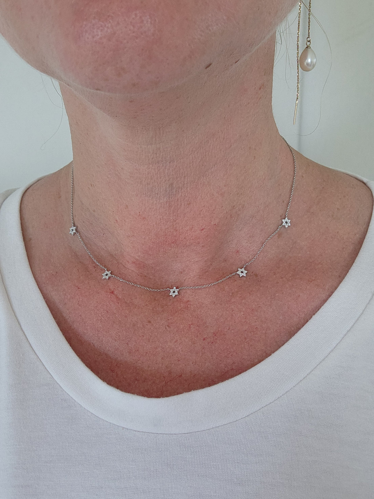 Five star of David necklace 14k gold set with diamonds.