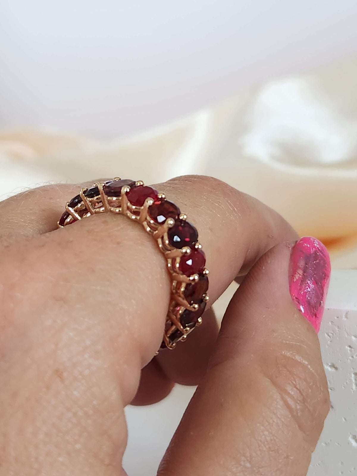 The "Red dream" ring. 14k rose gold infinity ring set with lab garn, tourmaline