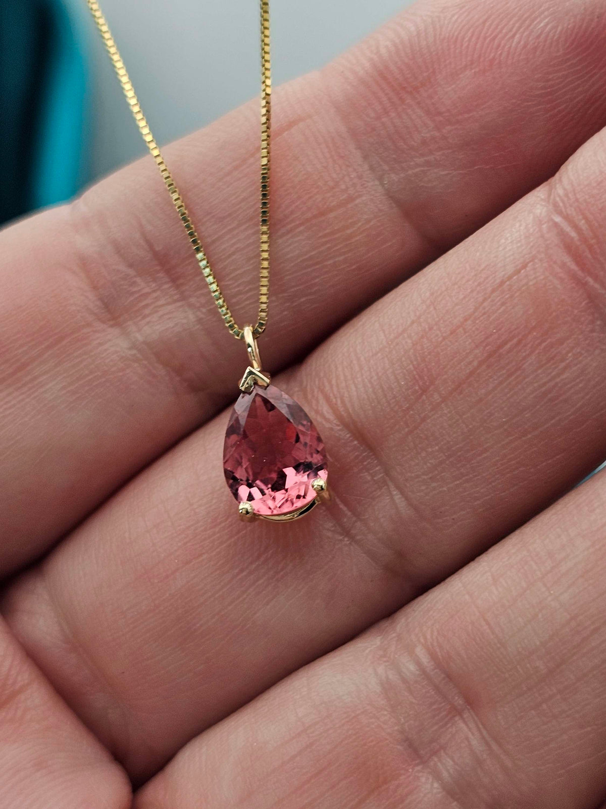 Pear shape Pink tourmaline pendant in 14k yellow gold.