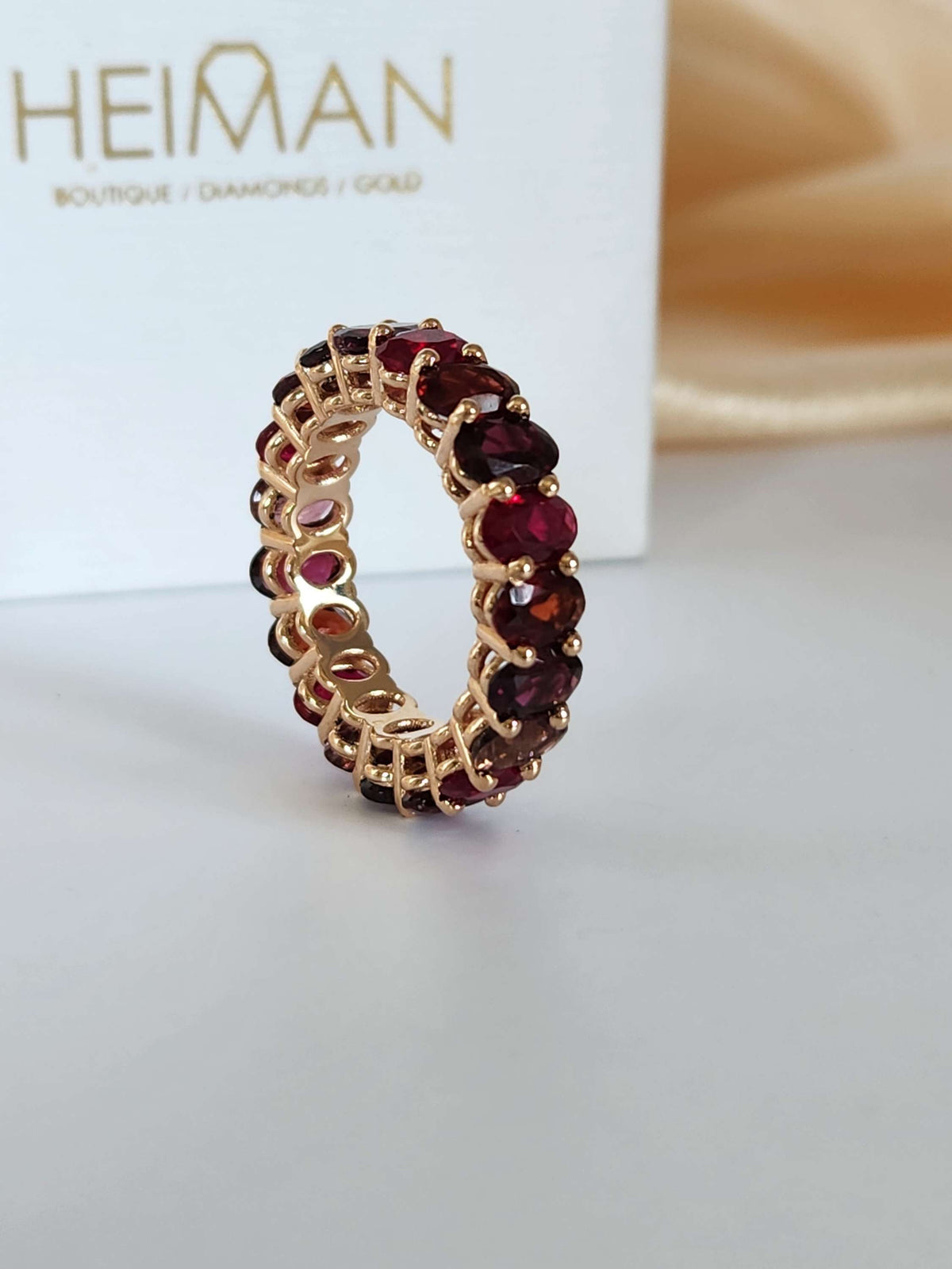 The "Red dream" ring. 14k rose gold infinity ring set with lab garn, tourmaline