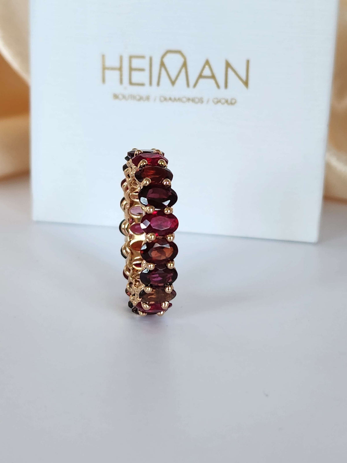 The "Red dream" ring. 14k rose gold infinity ring set with lab garn, tourmaline