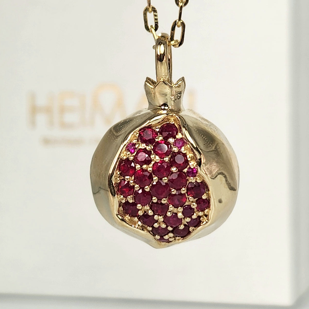 Large 20mm pomegranate in 14k gold set with natural ruby's
