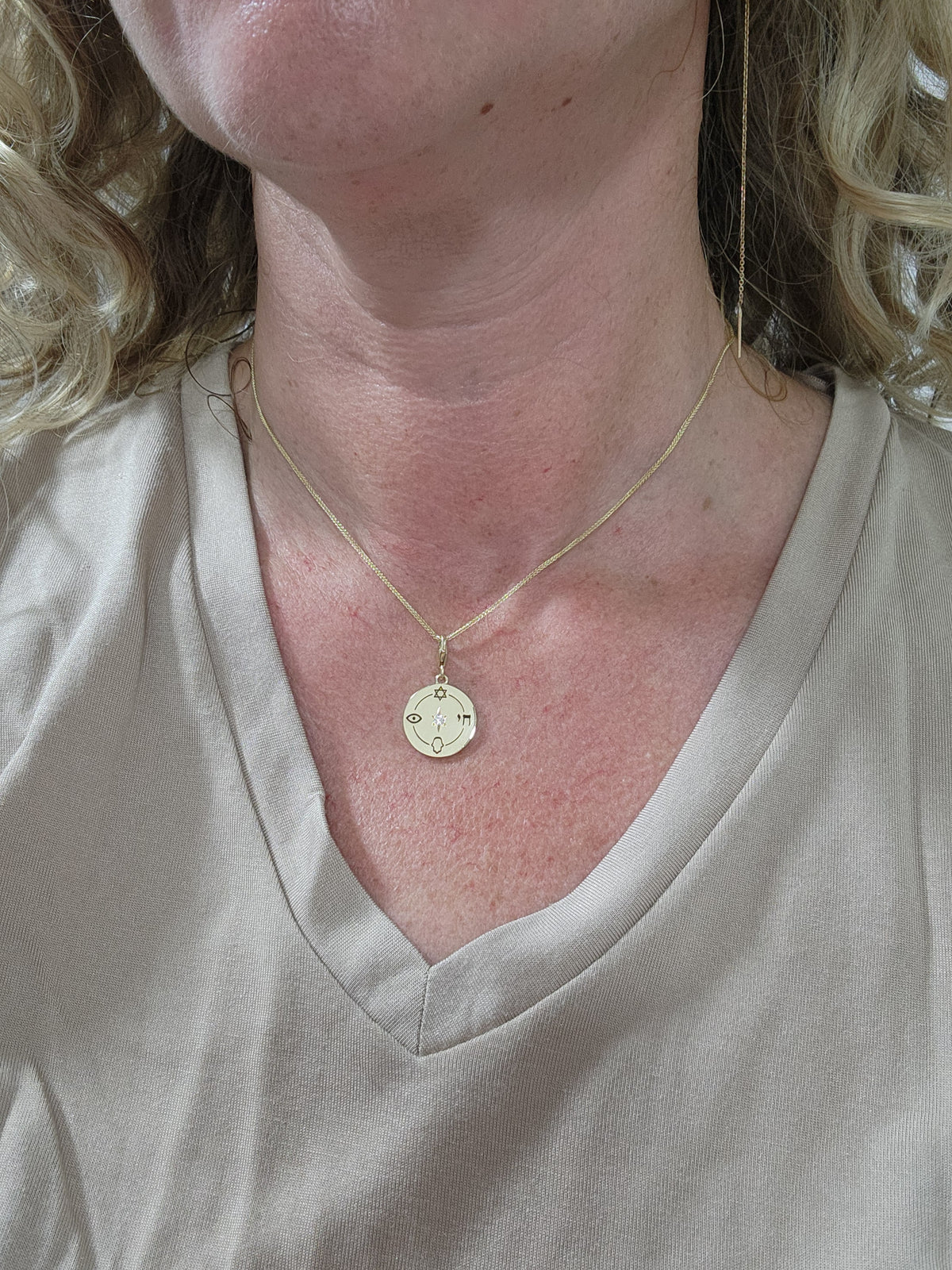 Medium size "Jewish compas" necklace, 14k gold set with a natural diamond.