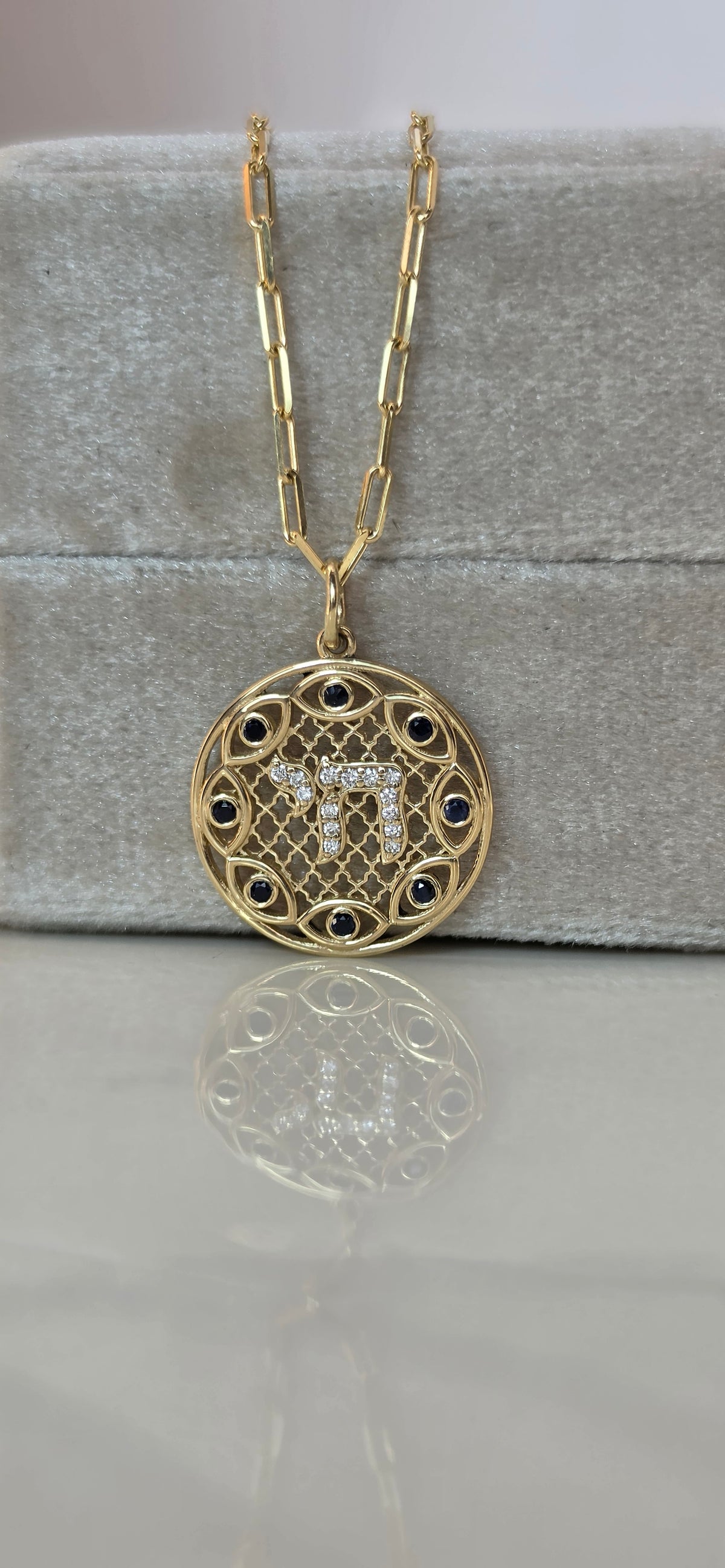 Hai and eye pendant