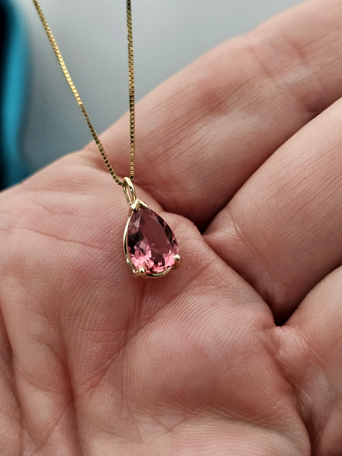 Pear shape Pink tourmaline  pendant in 14k yellow gold.