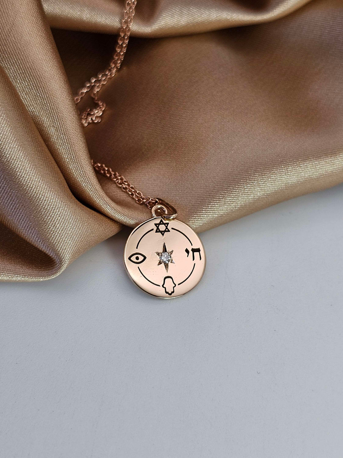 Small "Jewish compas" necklace, 14k gold set with natural diamond.