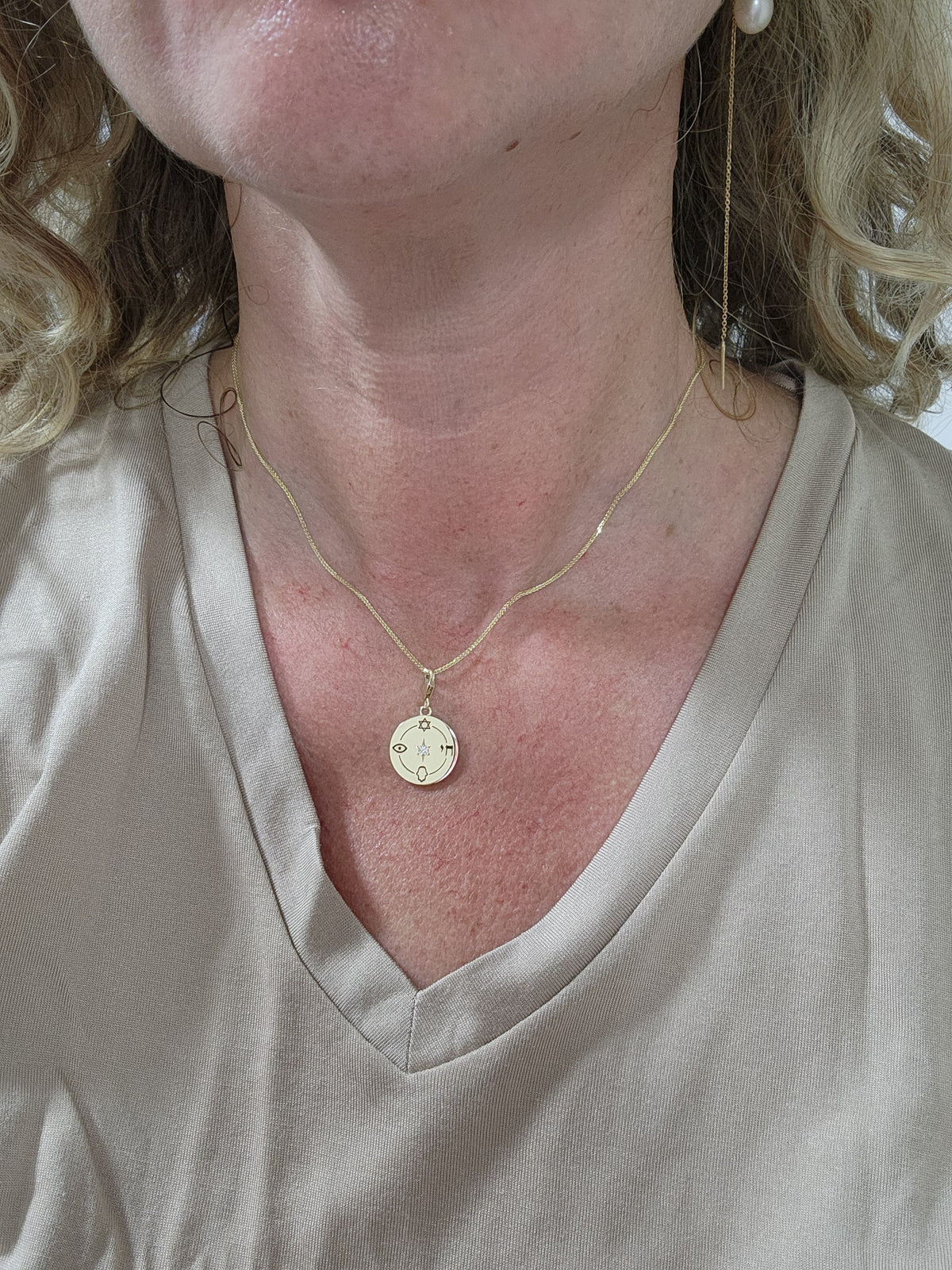 Medium size "Jewish compas" necklace, 14k gold set with a natural diamond.