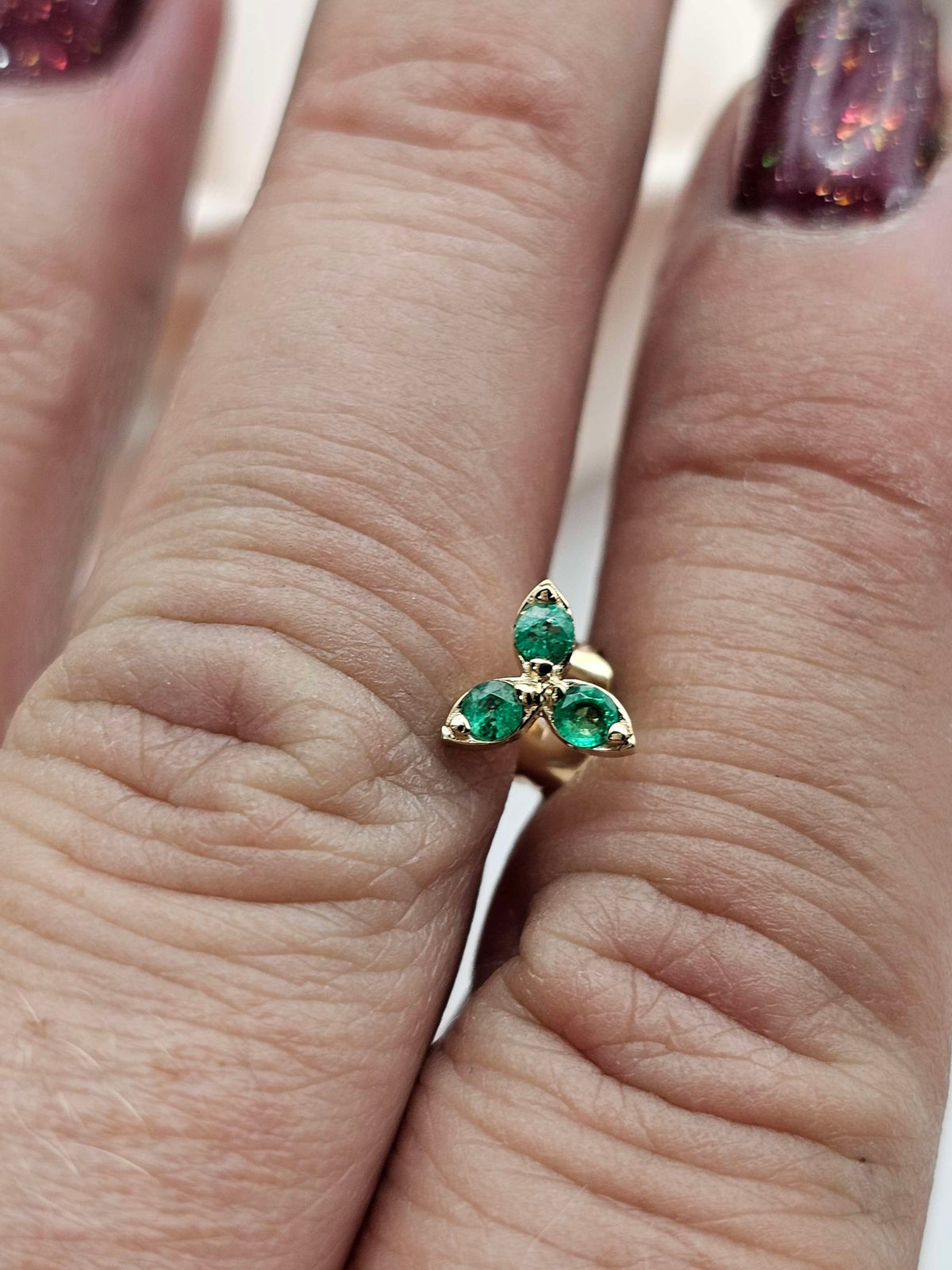 Single three stone stud earring, 14k gold set with natural Emerald.