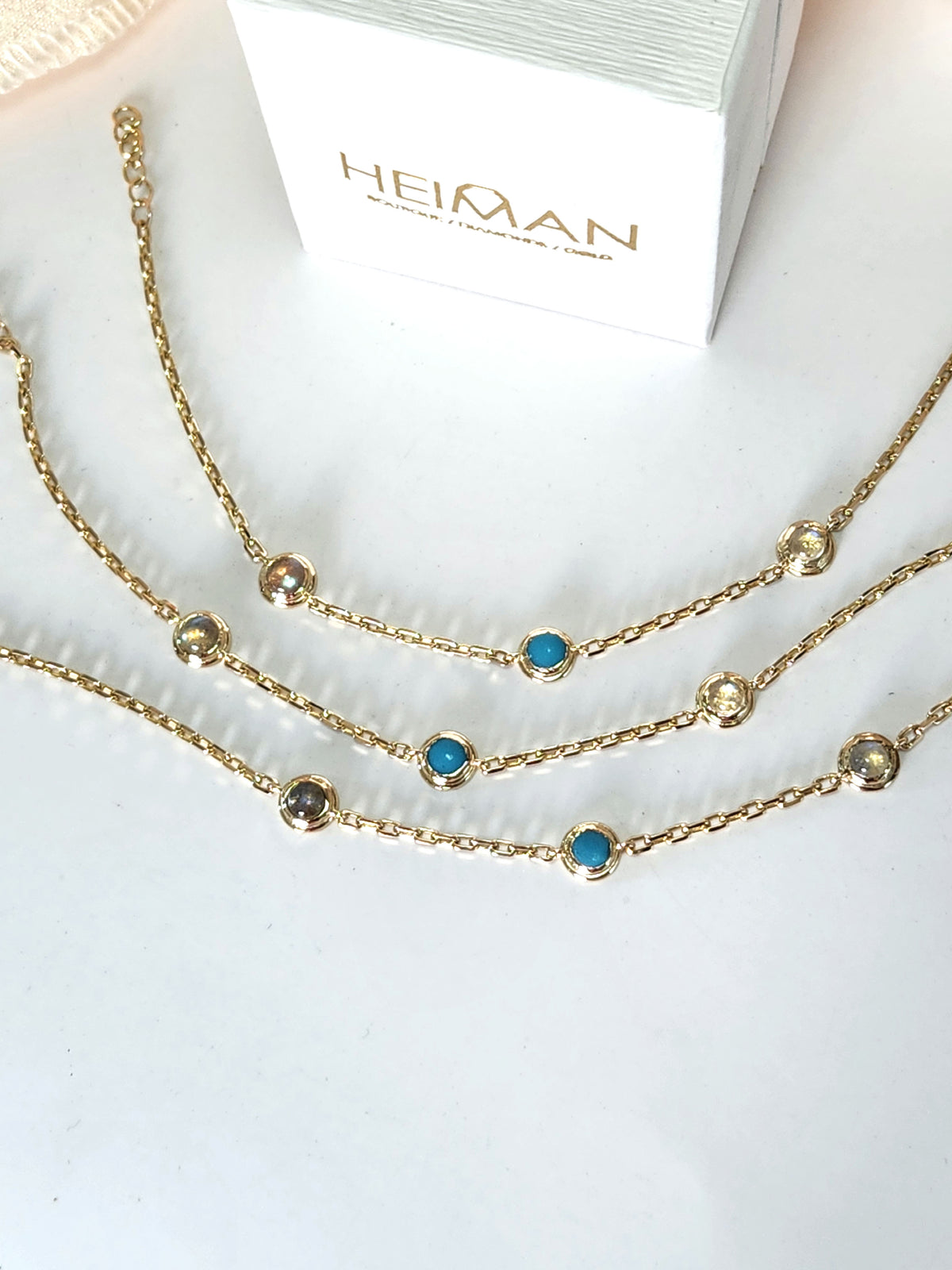 Gold eye bracelet set with natural gems.