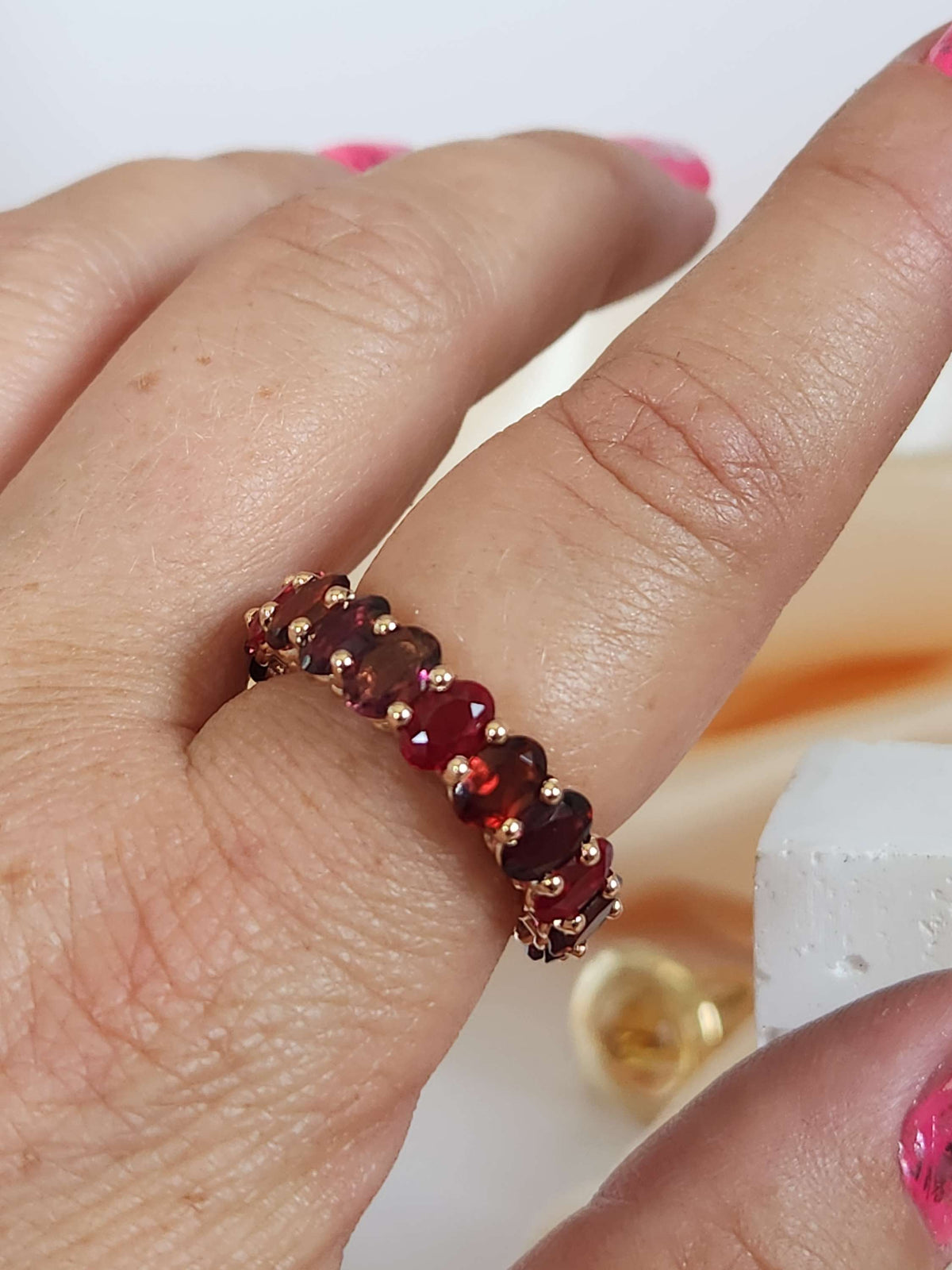 The "Red dream" ring. 14k rose gold infinity ring set with lab garn, tourmaline