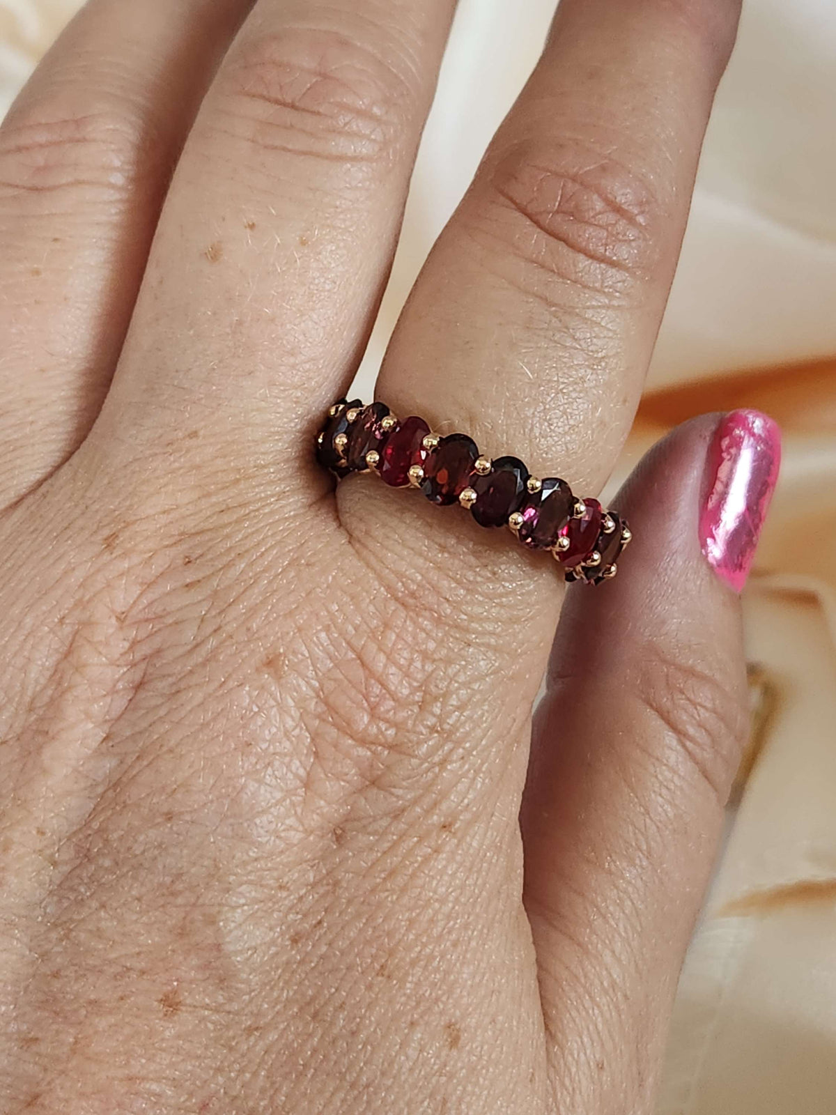 The "Red dream" ring. 14k rose gold infinity ring set with lab garn, tourmaline