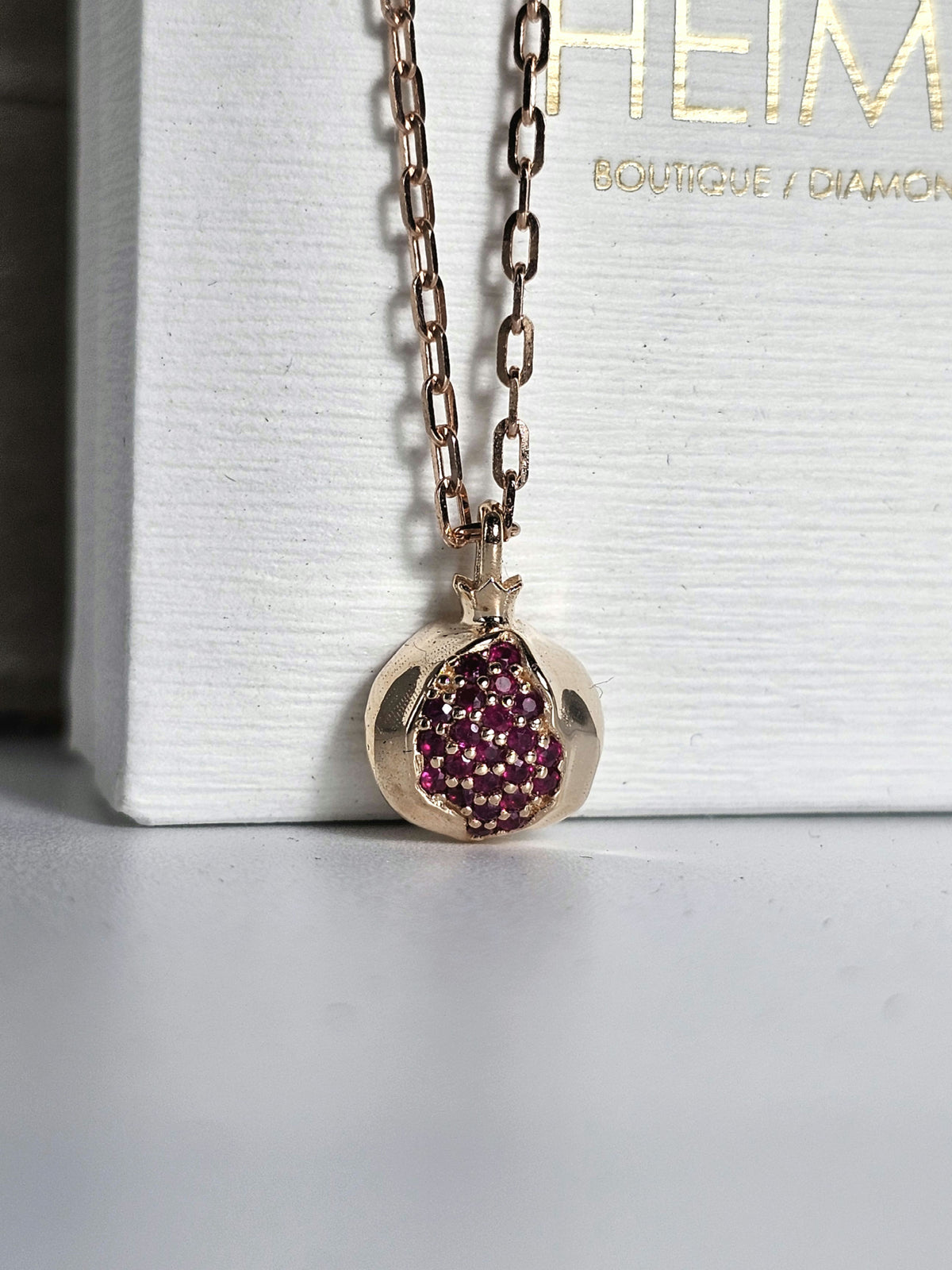 Mini Ruby Star Pomegranate 14k pendant 10mm long  comes on 14k chain.