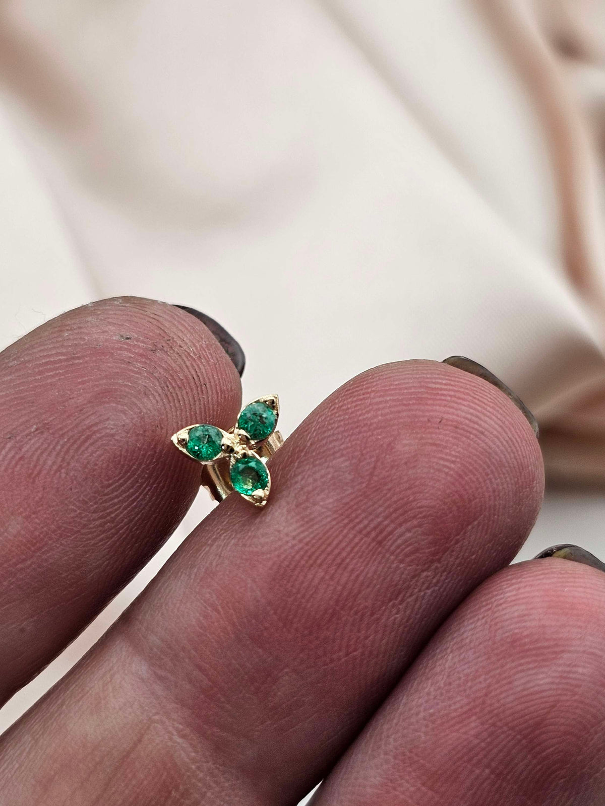 Single three stone stud earring, 14k gold set with natural Emerald.