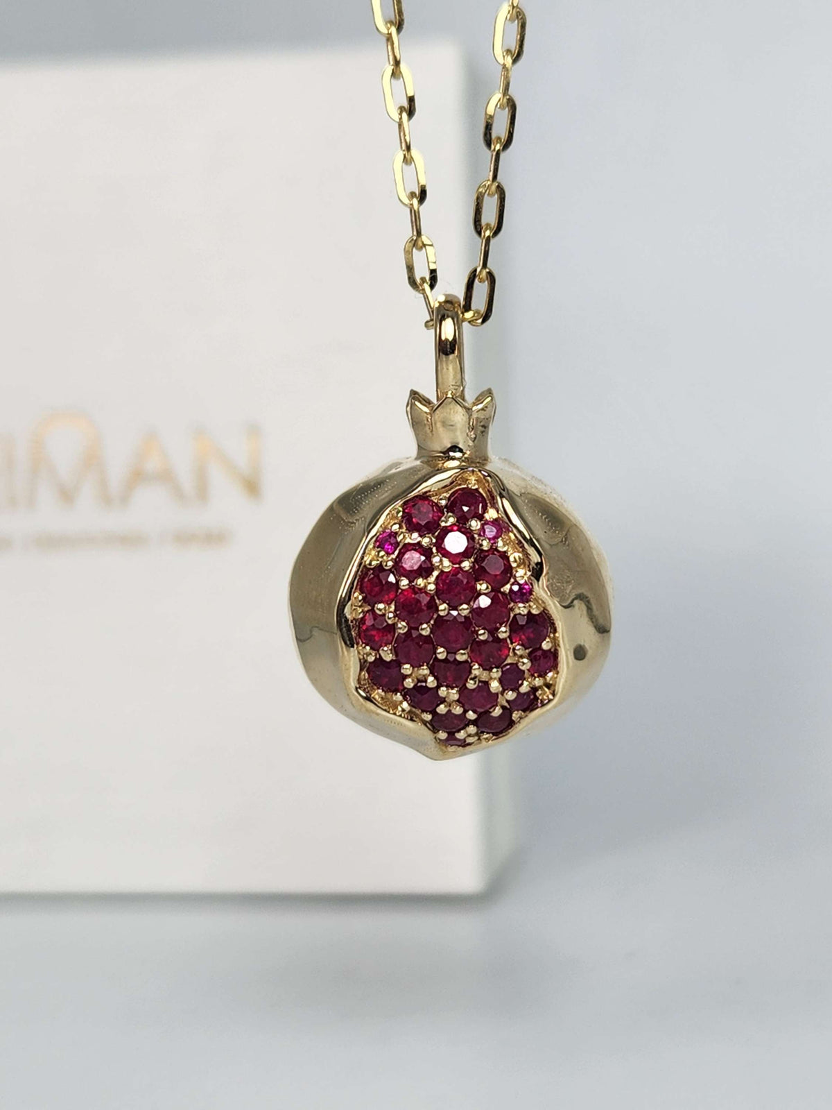 Large 20mm pomegranate in 14k gold set with natural ruby's