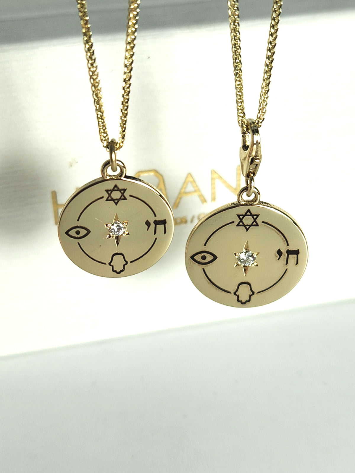 Medium size "Jewish compas" necklace, 14k gold set with a natural diamond.