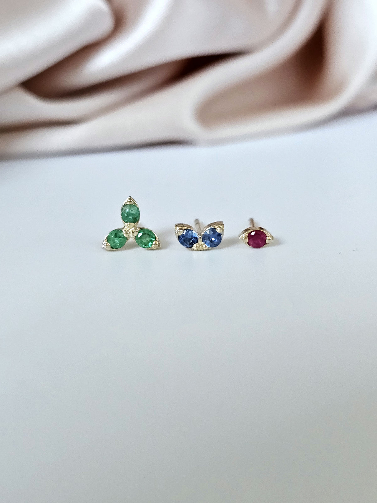 Three stud earrings 14k gold and natural gems for multiple ear holes.
