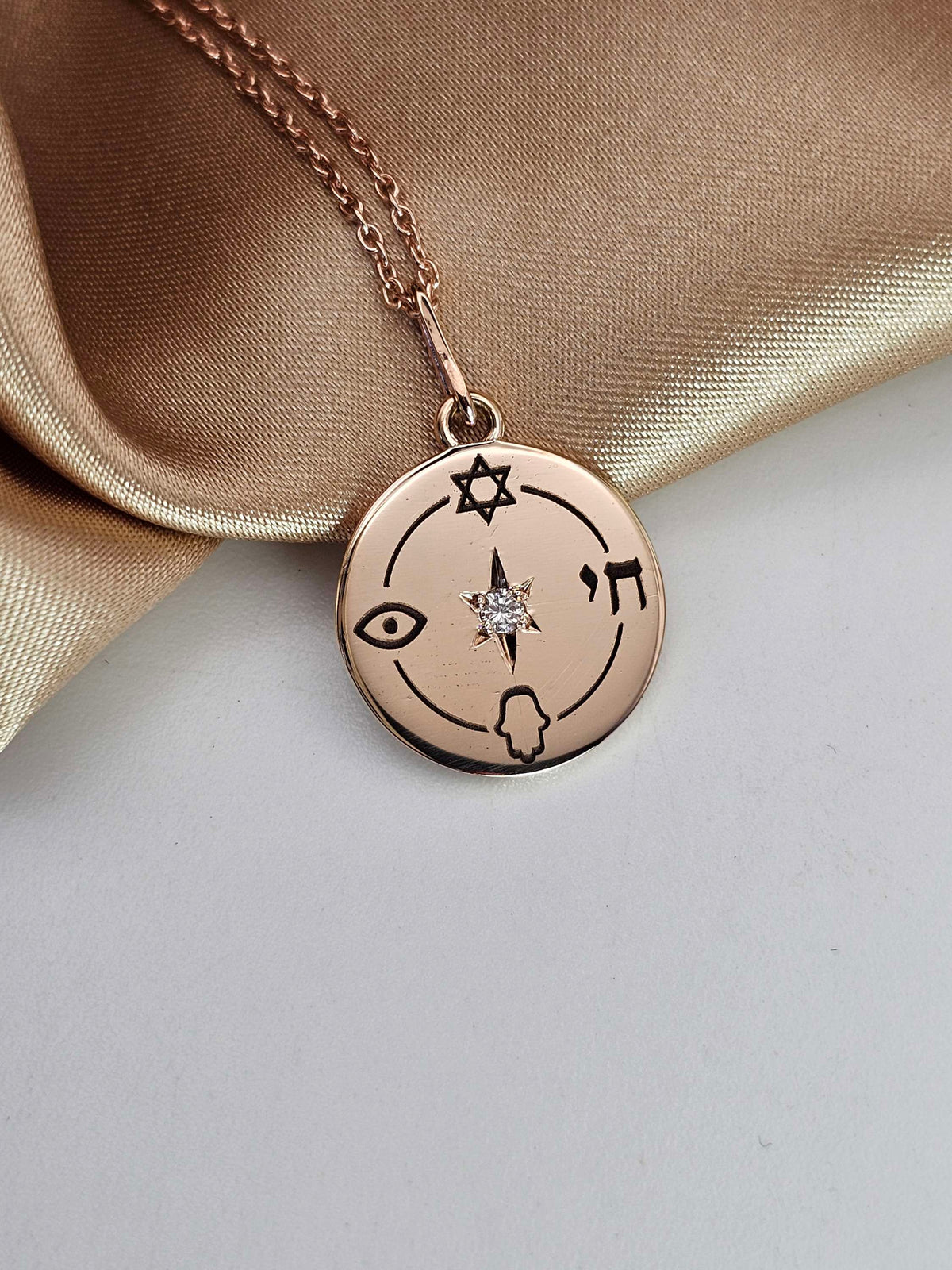 Small "Jewish compas" necklace, 14k gold set with natural diamond.