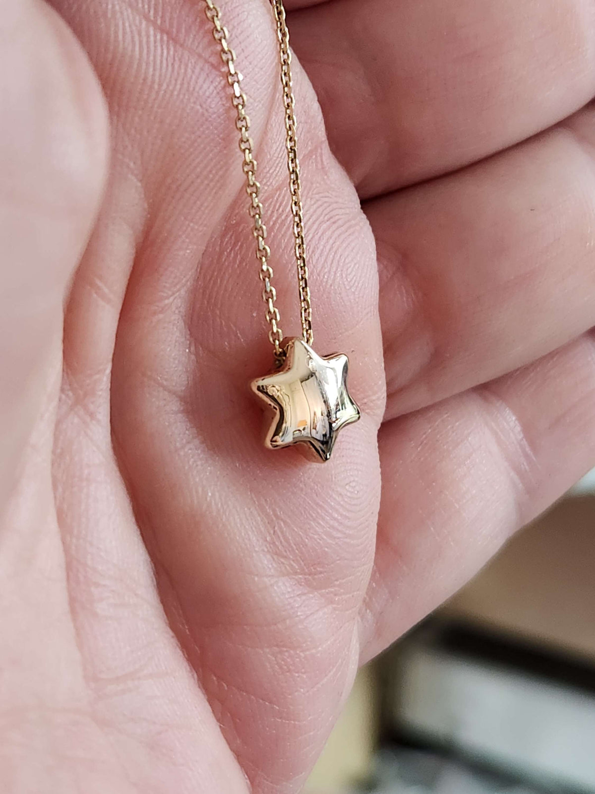 Bubble Star david necklace comes on 18 inch 14k chain.